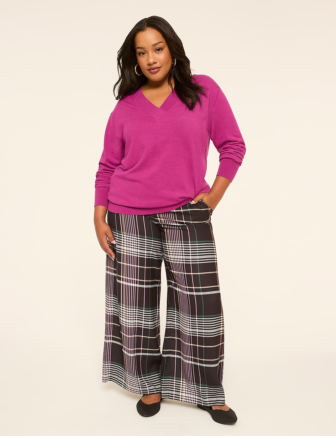 A woman in a magenta v-neck sweater and wide-leg plaid pants stands against a plain, light background. Product Image 3