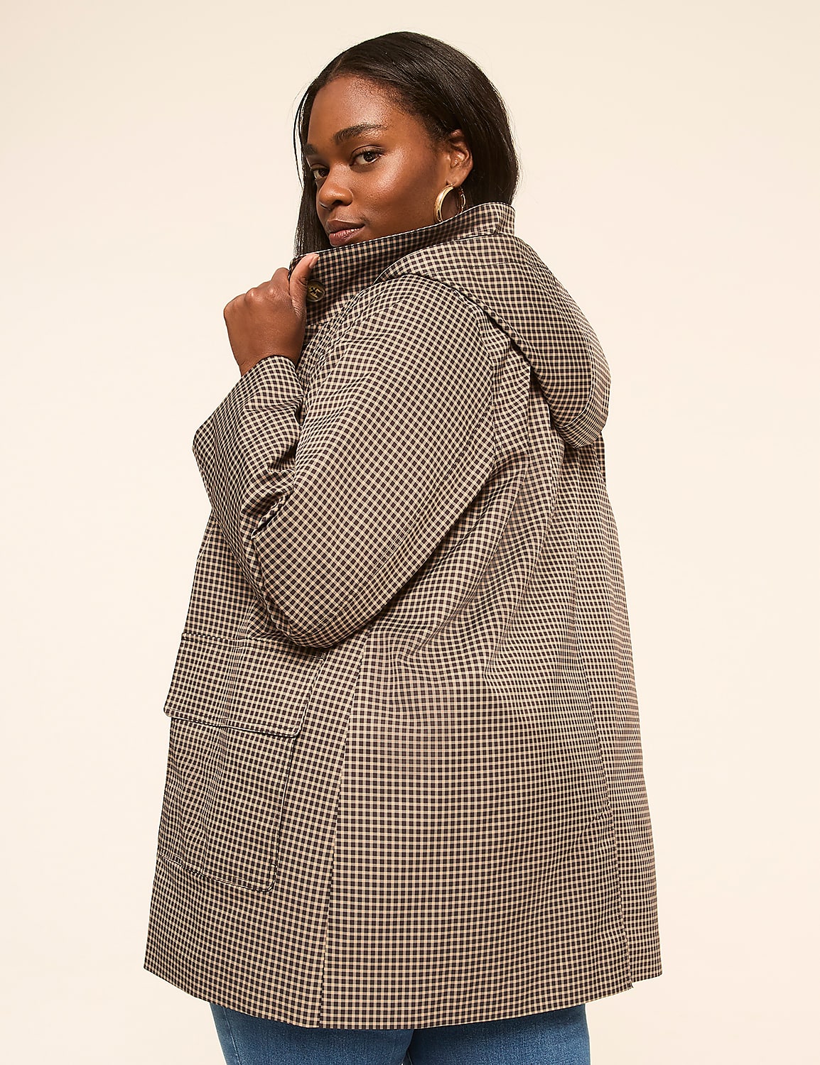 A woman in a checkered jacket stands against a plain, light-colored background. Product Image 2