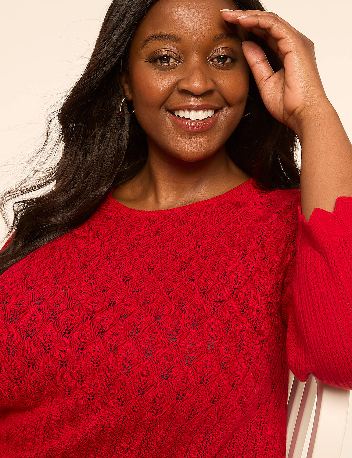 A smiling woman in a red sweater is in the foreground, with a plain, light-colored background. Product Image 4