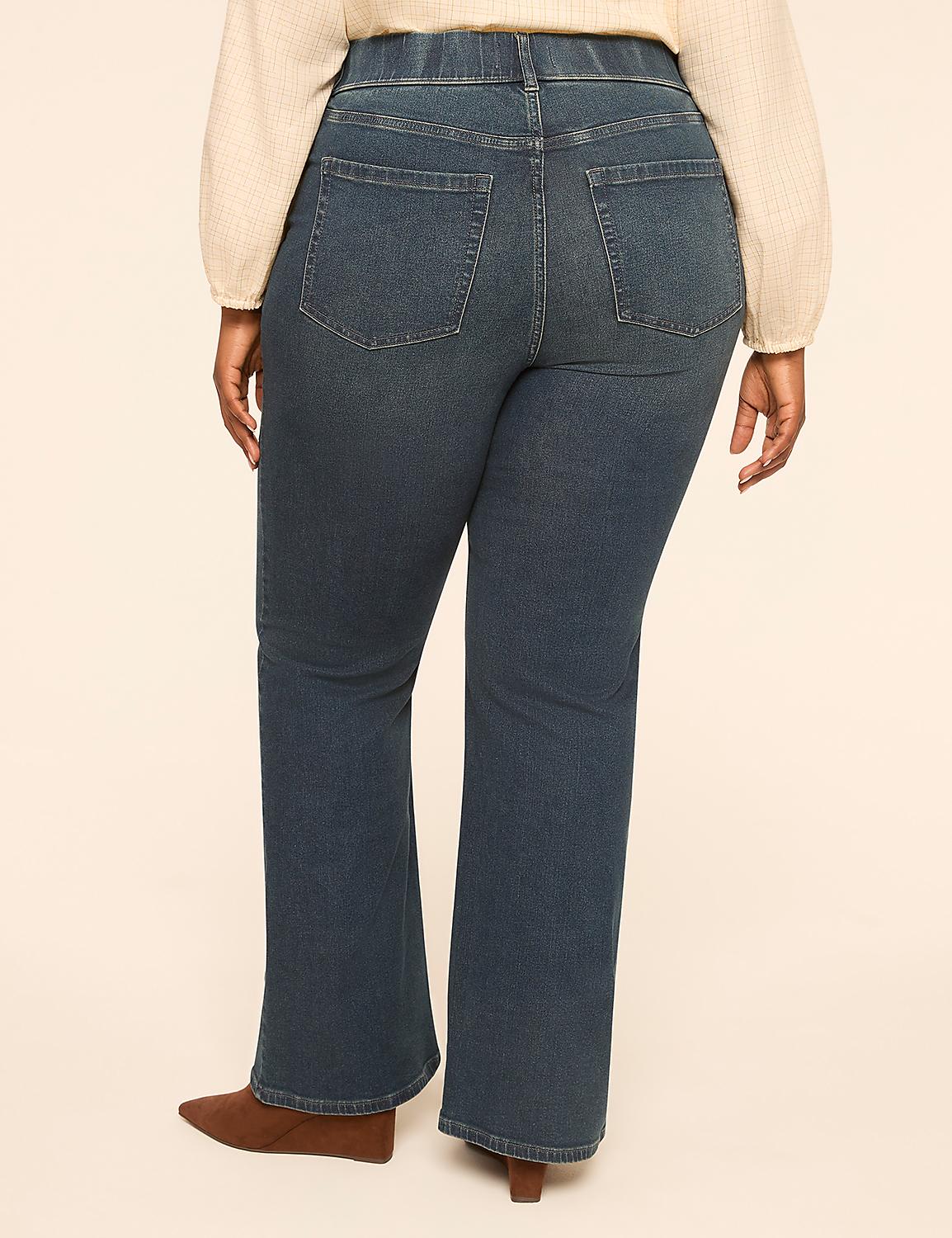 A person wearing dark wash bootcut jeans and brown boots stands against a plain, light-colored background. Product Image 2