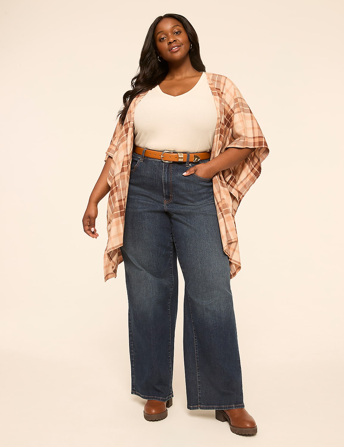 A woman in a cream top, plaid kimono, and wide-leg jeans stands against a plain, light-colored background. Product Image 3