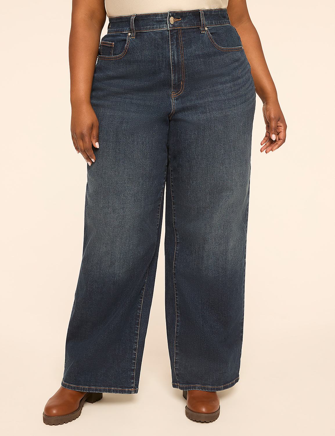 A person stands in dark wash wide-leg jeans and brown boots against a plain, light-colored background. Product Image 1