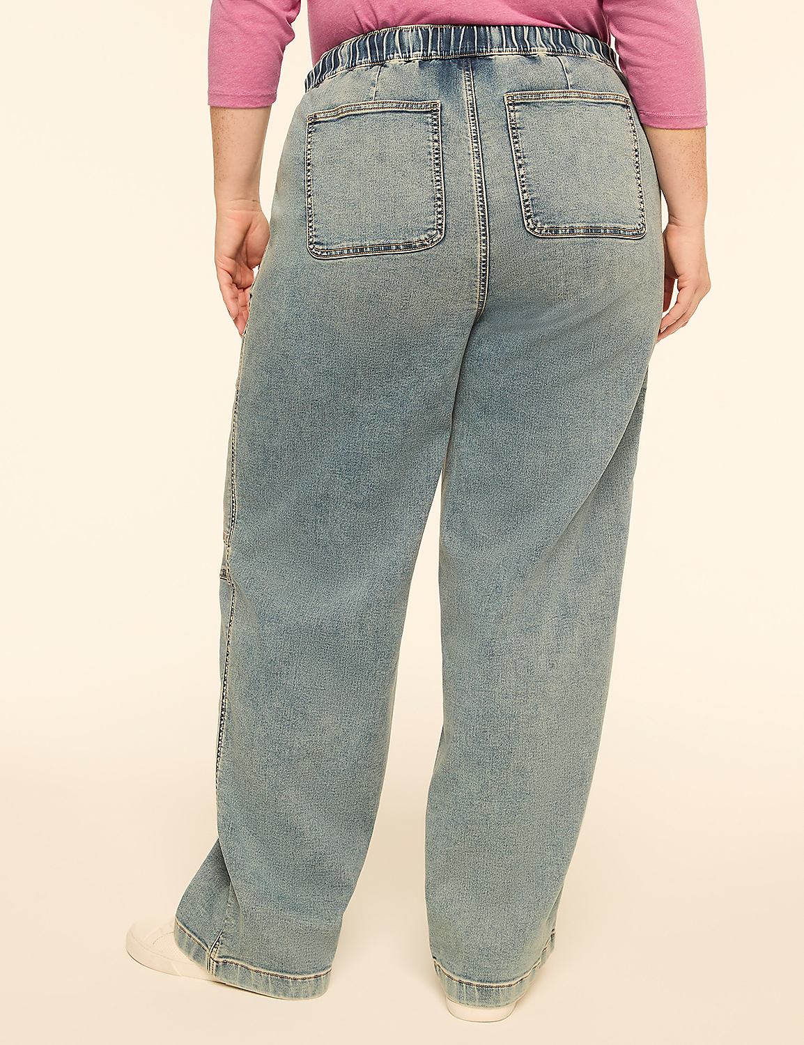A person wearing light blue denim jeans with white sneakers stands against a plain, light-colored background. Product Image 2