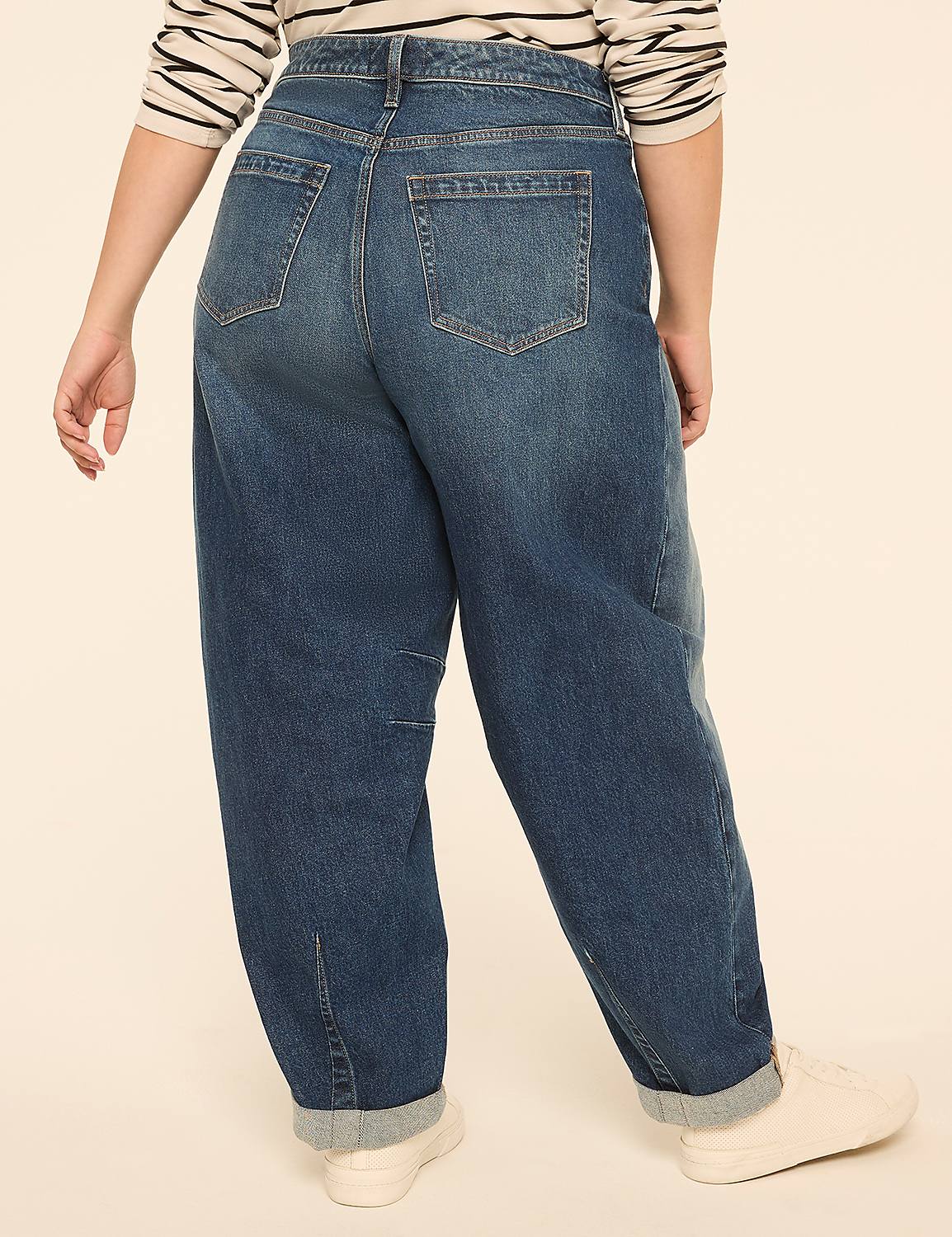 A person wearing baggy blue jeans and white sneakers stands against a plain, light-colored background. Product Image 2