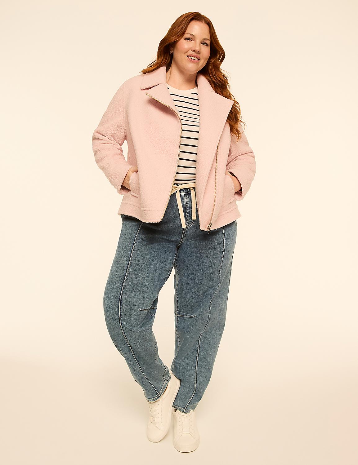 A woman in a pink jacket and jeans stands against a plain, light-colored background. Product Image 3
