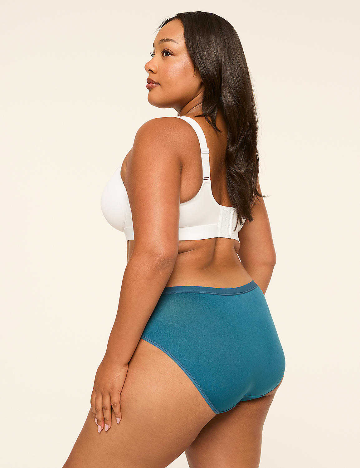 A woman in a white bra and teal underwear stands against a plain, light background. Product Image 2