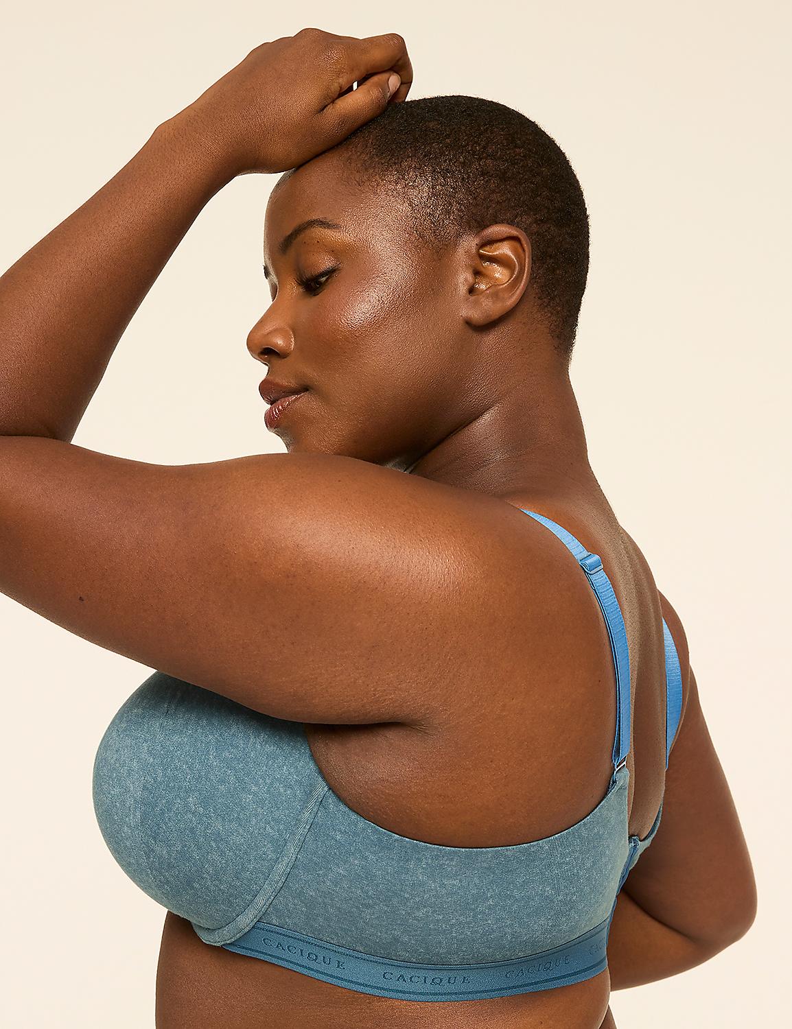 A woman in a blue bra poses with her arm raised against a plain background. Product Image 3