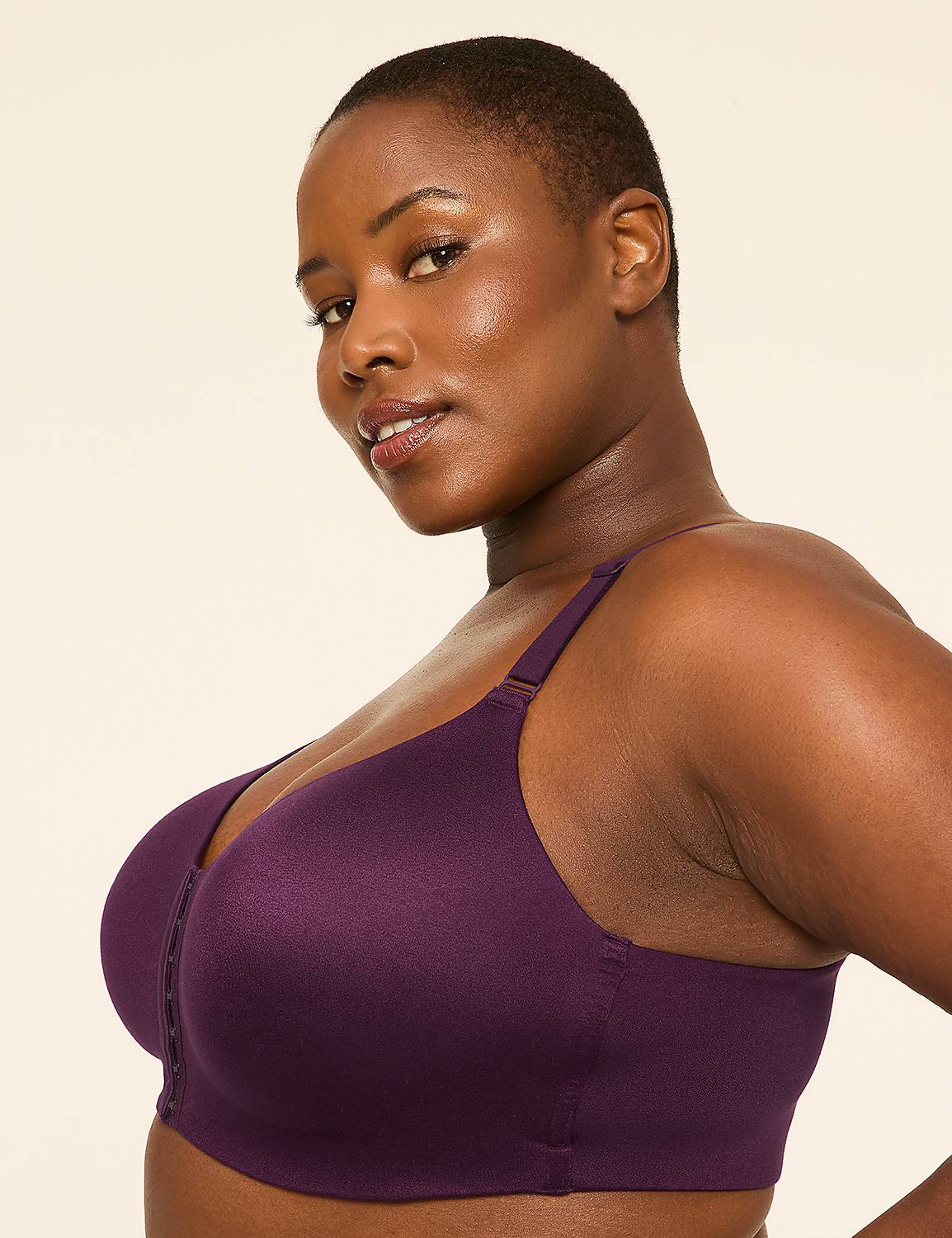 A woman with short hair and dark skin poses in a purple bra against a plain, light-colored background. Product Image 3