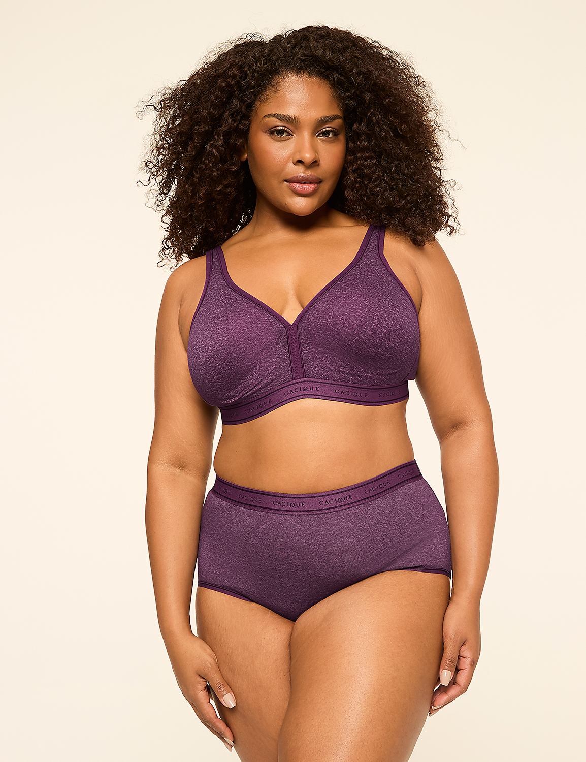 A woman with curly dark hair poses in a purple bra and matching underwear against a plain, light-colored background. Product Image 4