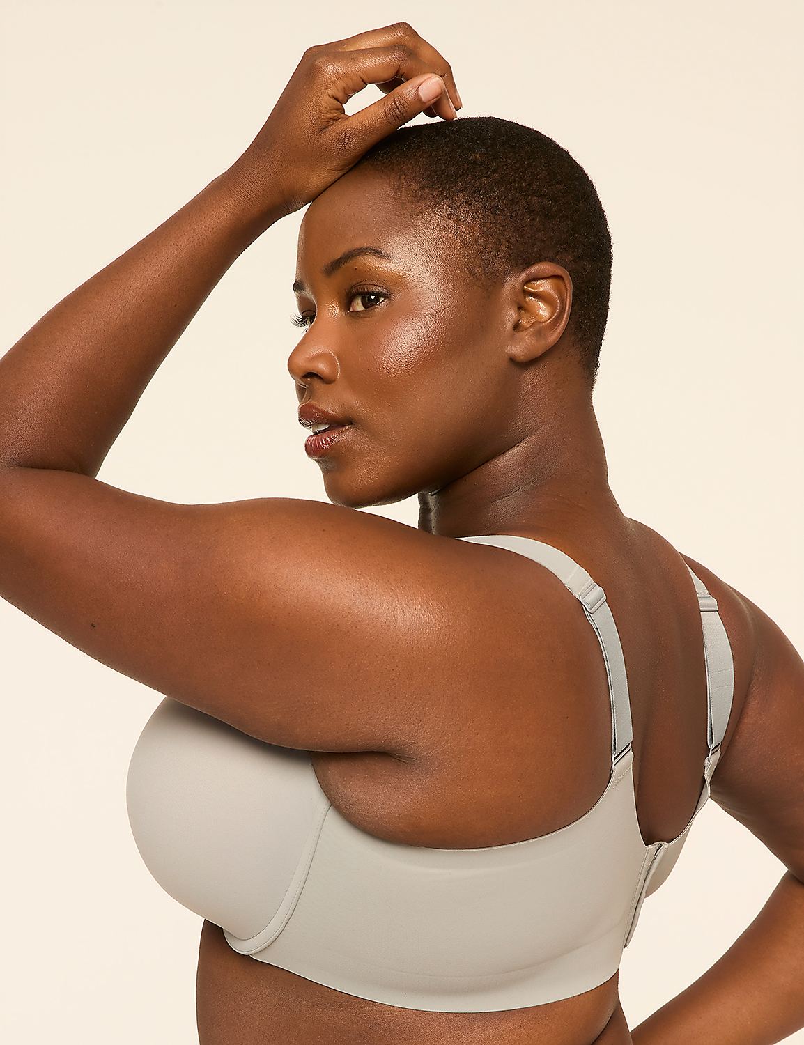 A woman in a light gray bra poses with her arm raised against a plain, light-colored background. Product Image 3
