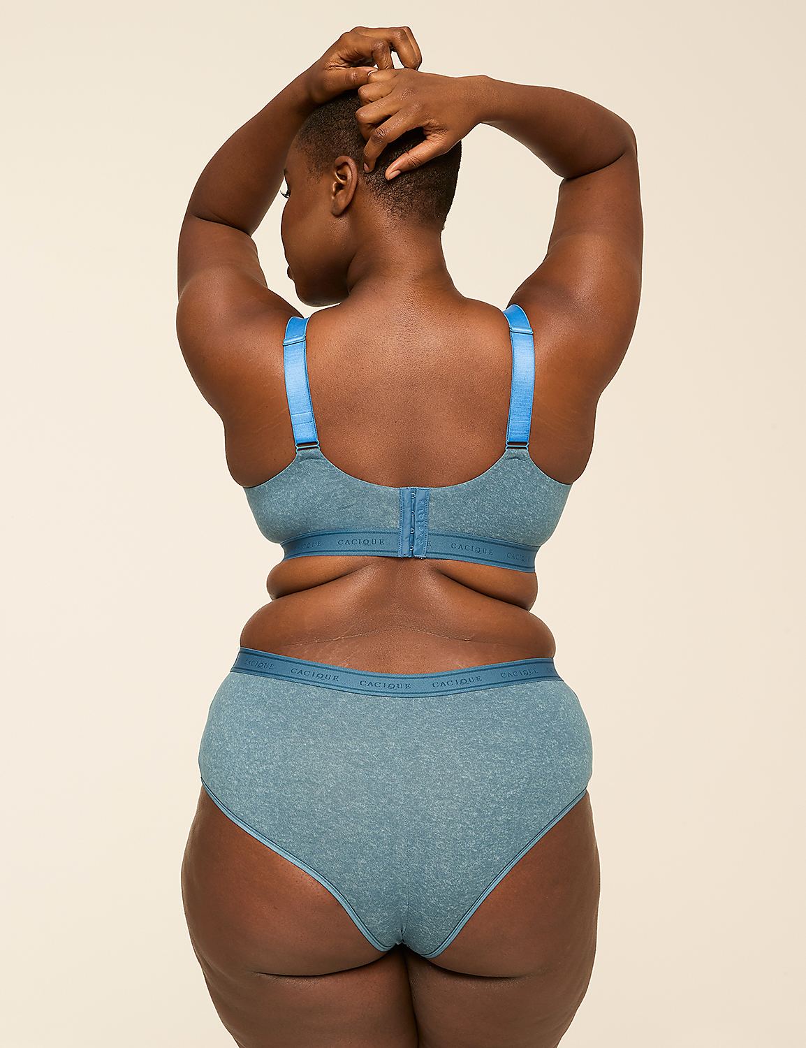 A woman in blue lingerie stands with her back to the viewer against a plain, light background. Product Image 2