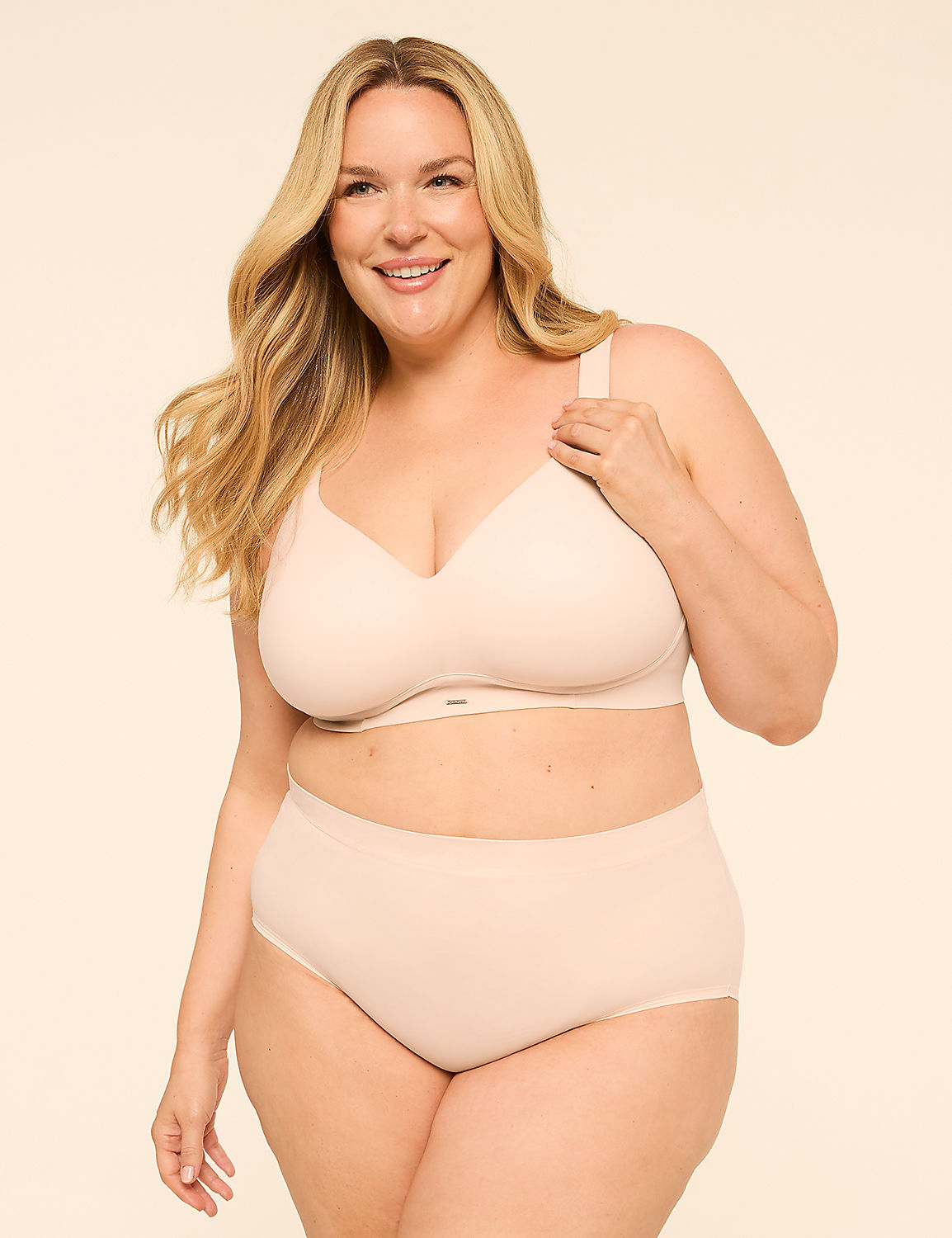 A smiling woman with blonde hair poses in a beige bra and matching underwear against a plain, light beige background. Product Image 4