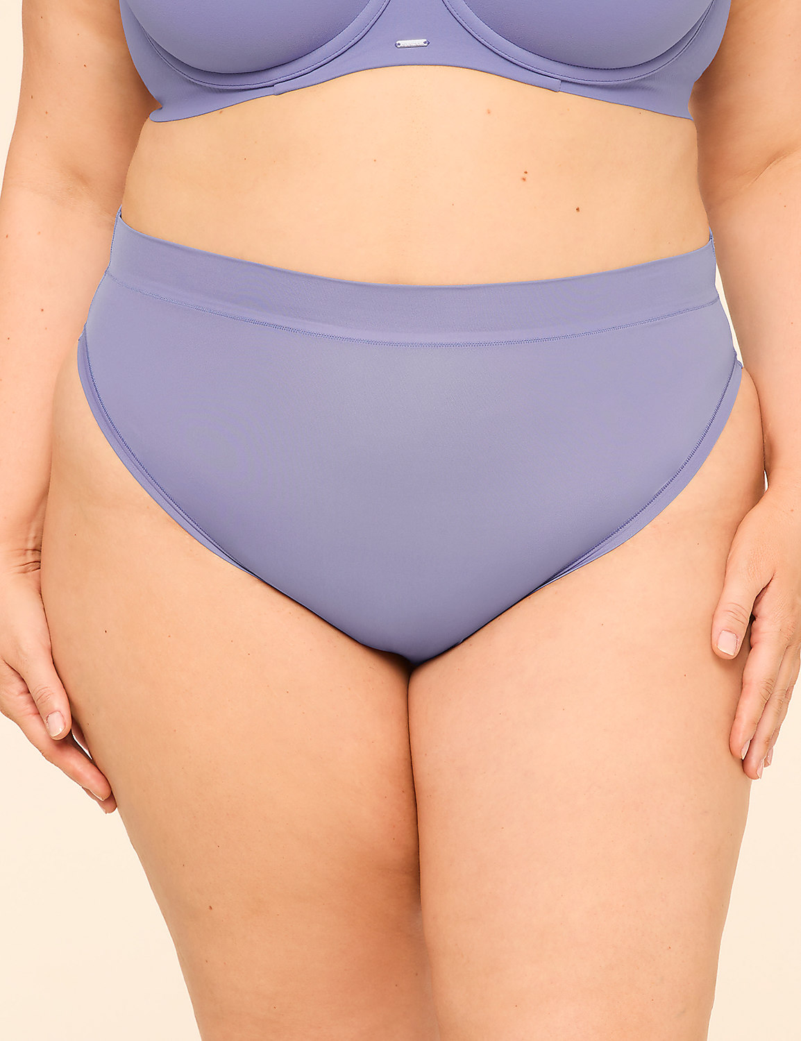 A person is wearing a light purple bra and high-waisted underwear against a plain beige background. Product Image 1