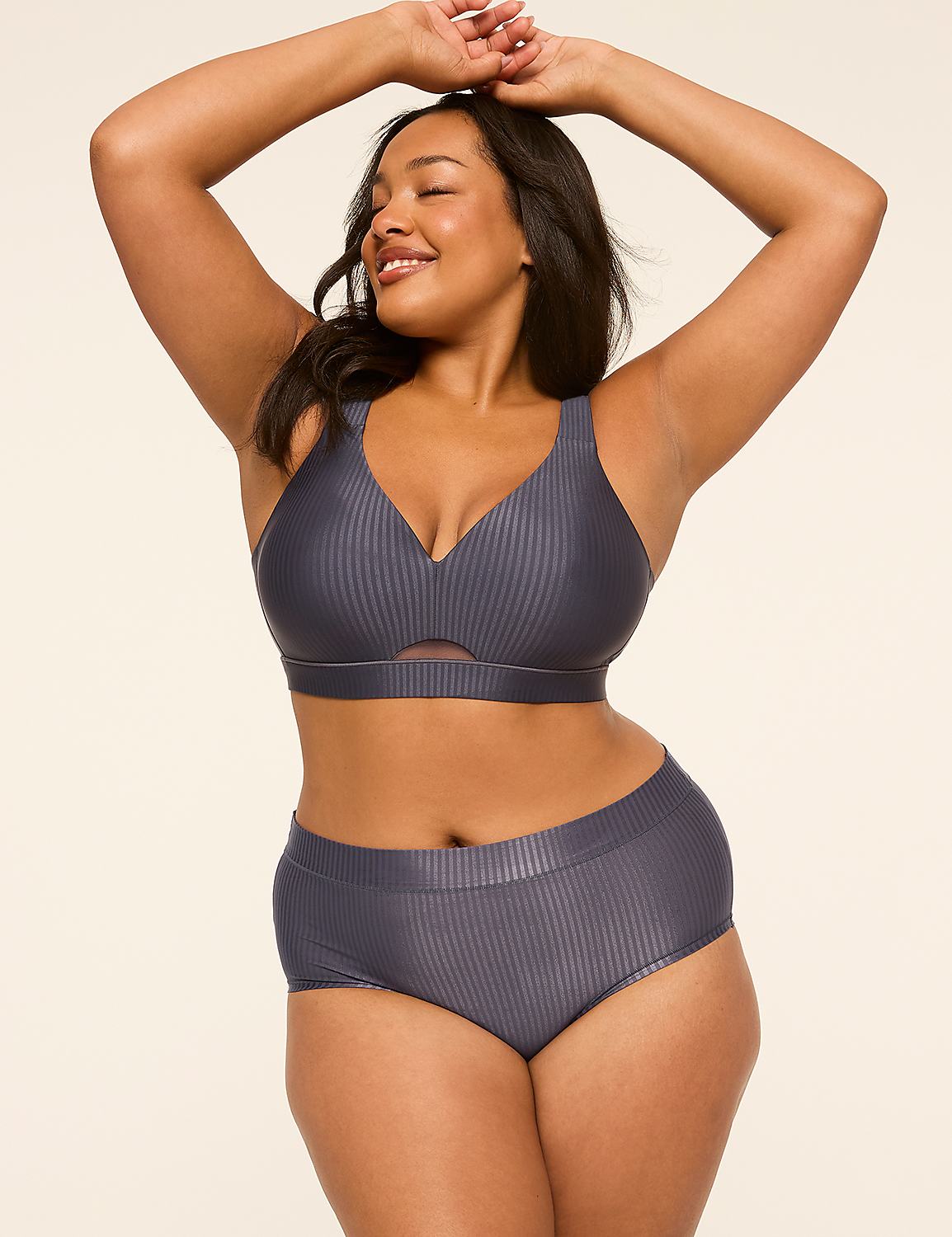 A woman in a ribbed grey bikini poses with her arms raised against a plain, light-colored background. Product Image 4