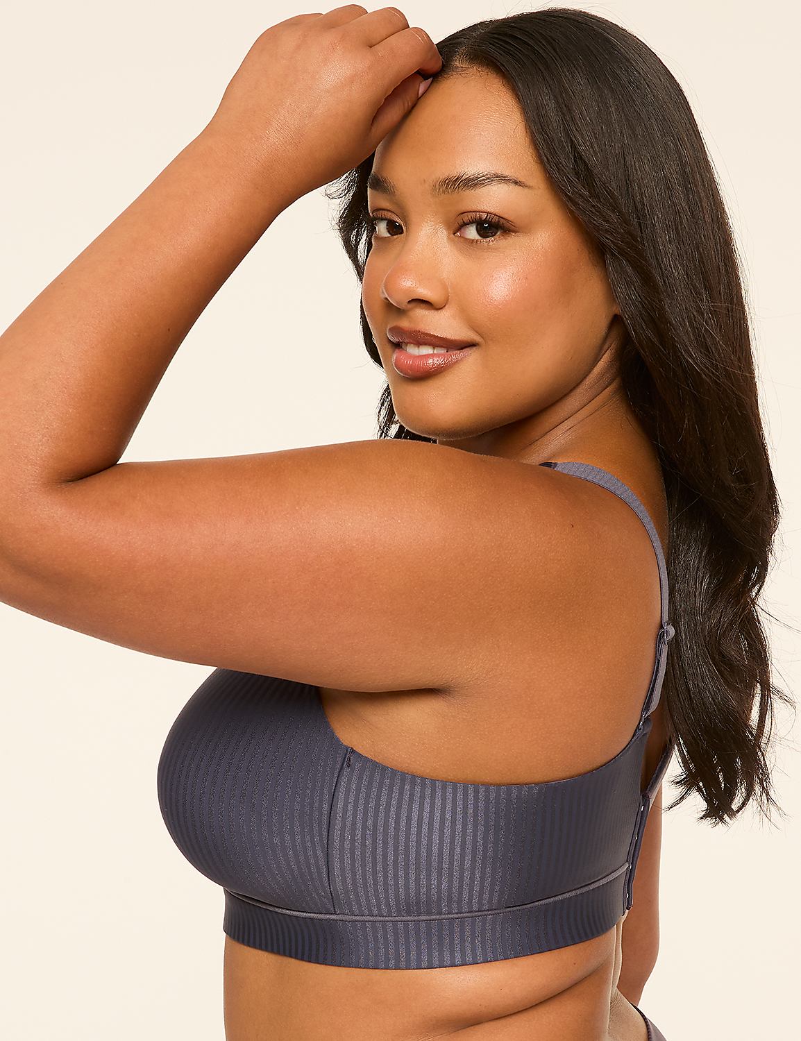 A woman in a gray ribbed bra poses with her arm raised against a plain, light-colored background. Product Image 3