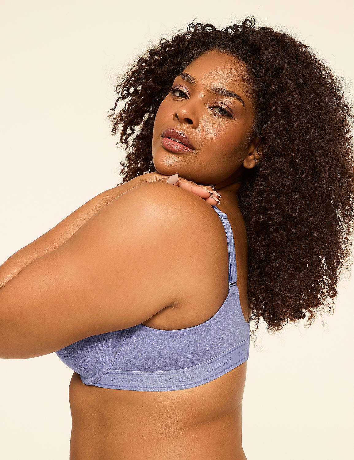 A woman with curly dark hair poses in a light purple bra against a plain, light-colored background. Product Image 3