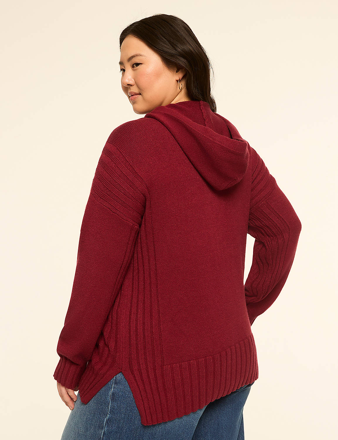 A woman in a maroon hooded sweater and blue jeans stands against a plain, light-colored background. Product Image 2