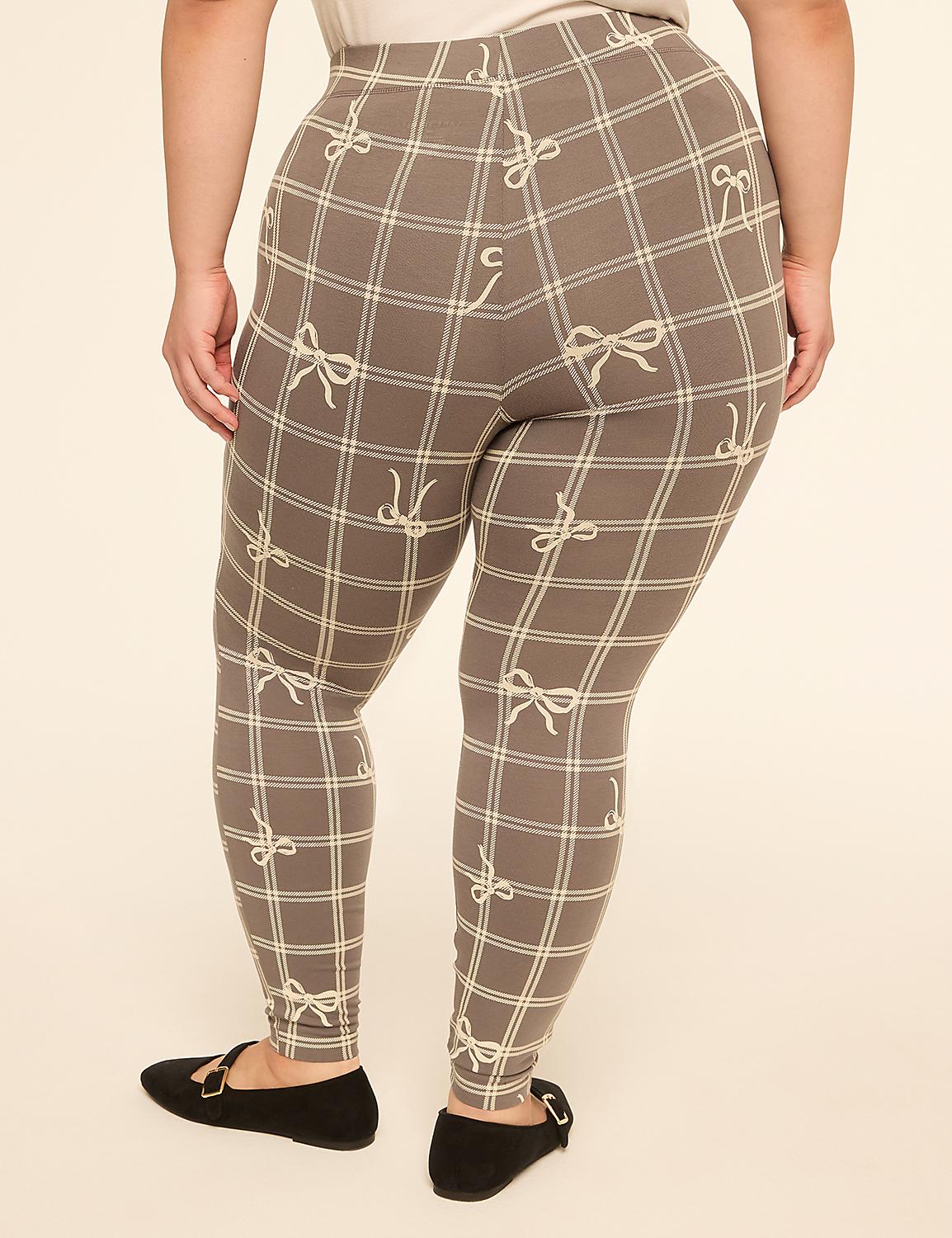 A person wearing plaid leggings with a bow pattern stands on a plain cream-colored background. Product Image 2