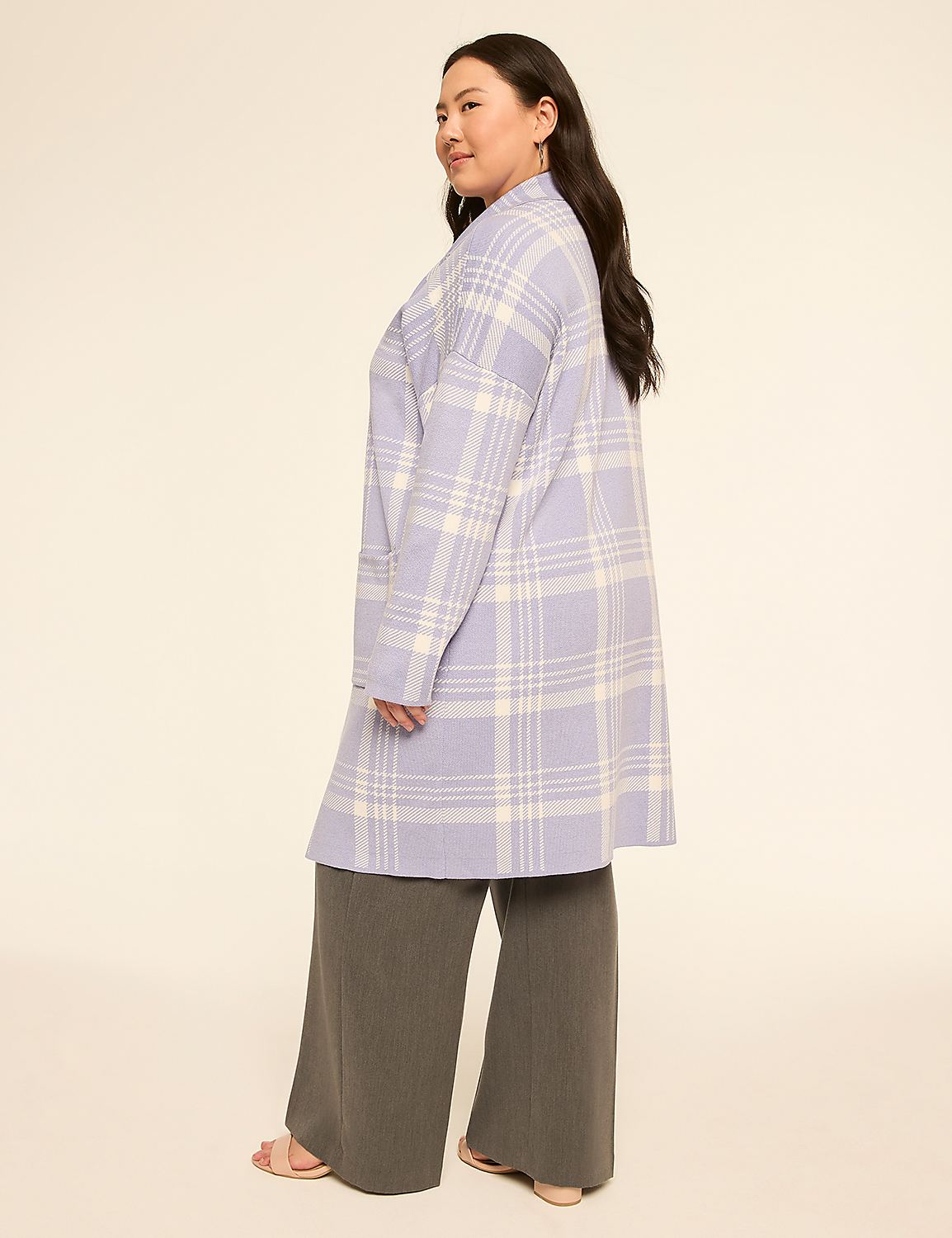 A woman in a plaid coat and wide-leg pants stands against a plain, light-colored background. Product Image 2