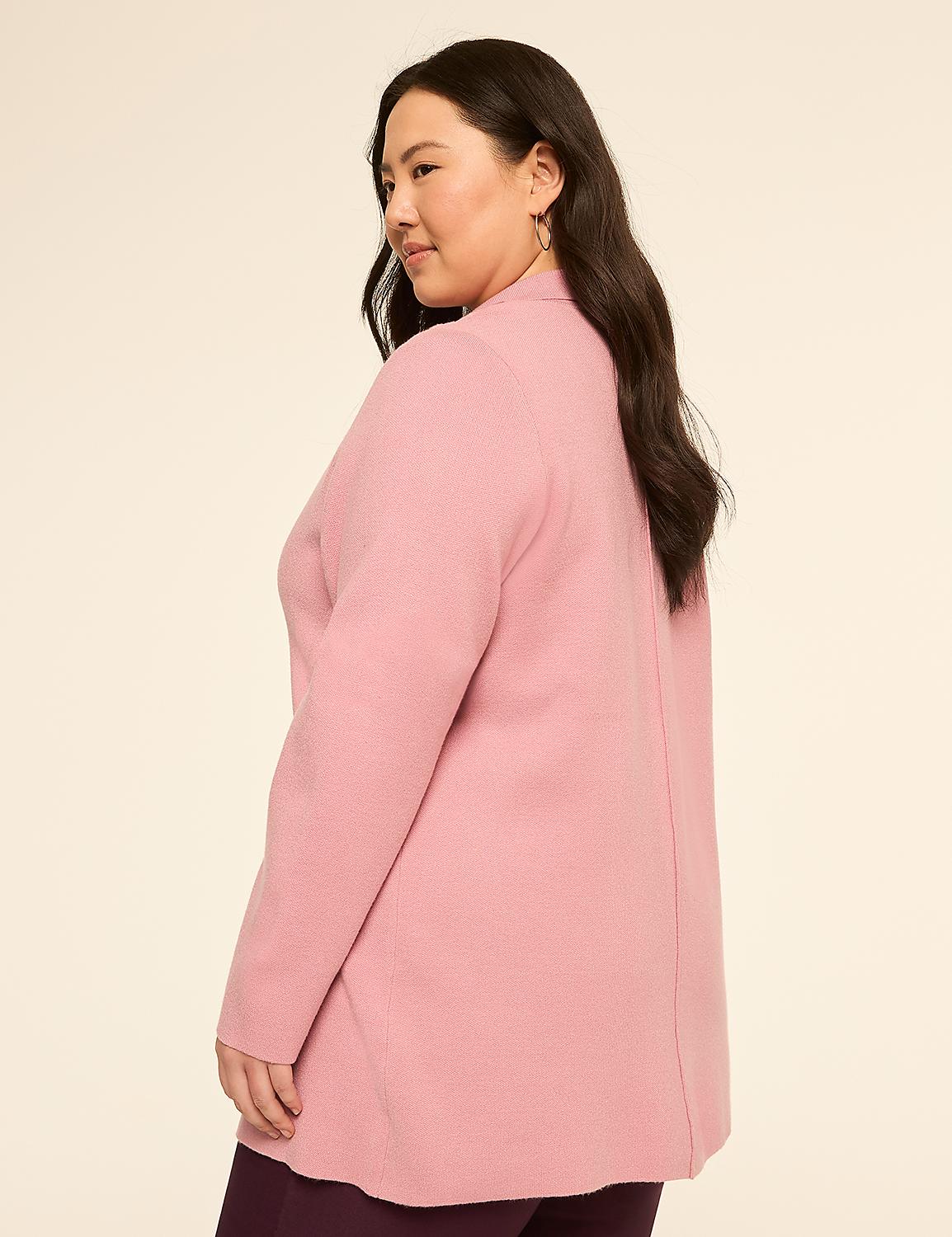 A woman in a pink cardigan and dark pants stands against a plain, light-colored background. Product Image 2