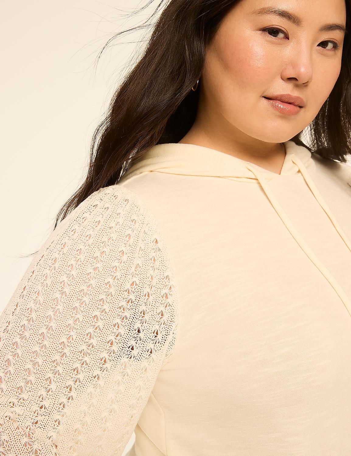 A woman with dark hair and a cream-colored hoodie with lace sleeves is shown against a plain, light background. Product Image 4