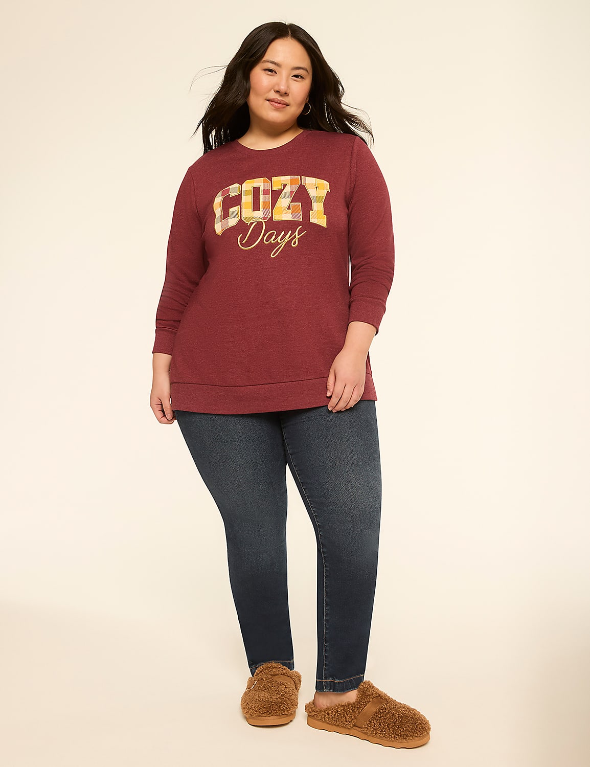 A woman in a maroon sweatshirt and dark jeans stands on a plain background, wearing fuzzy slippers. Product Image 3