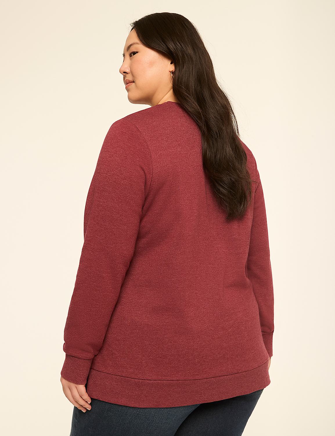 A woman in a maroon sweatshirt stands against a plain, light-colored background. Product Image 2