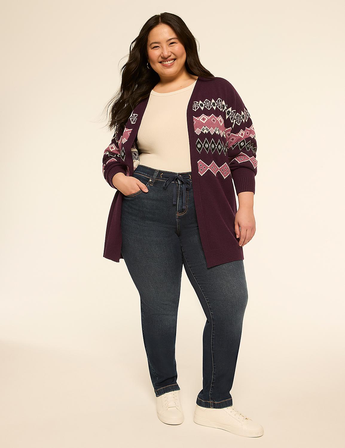A smiling woman in a patterned cardigan and jeans stands against a plain, light-colored background. Product Image 3