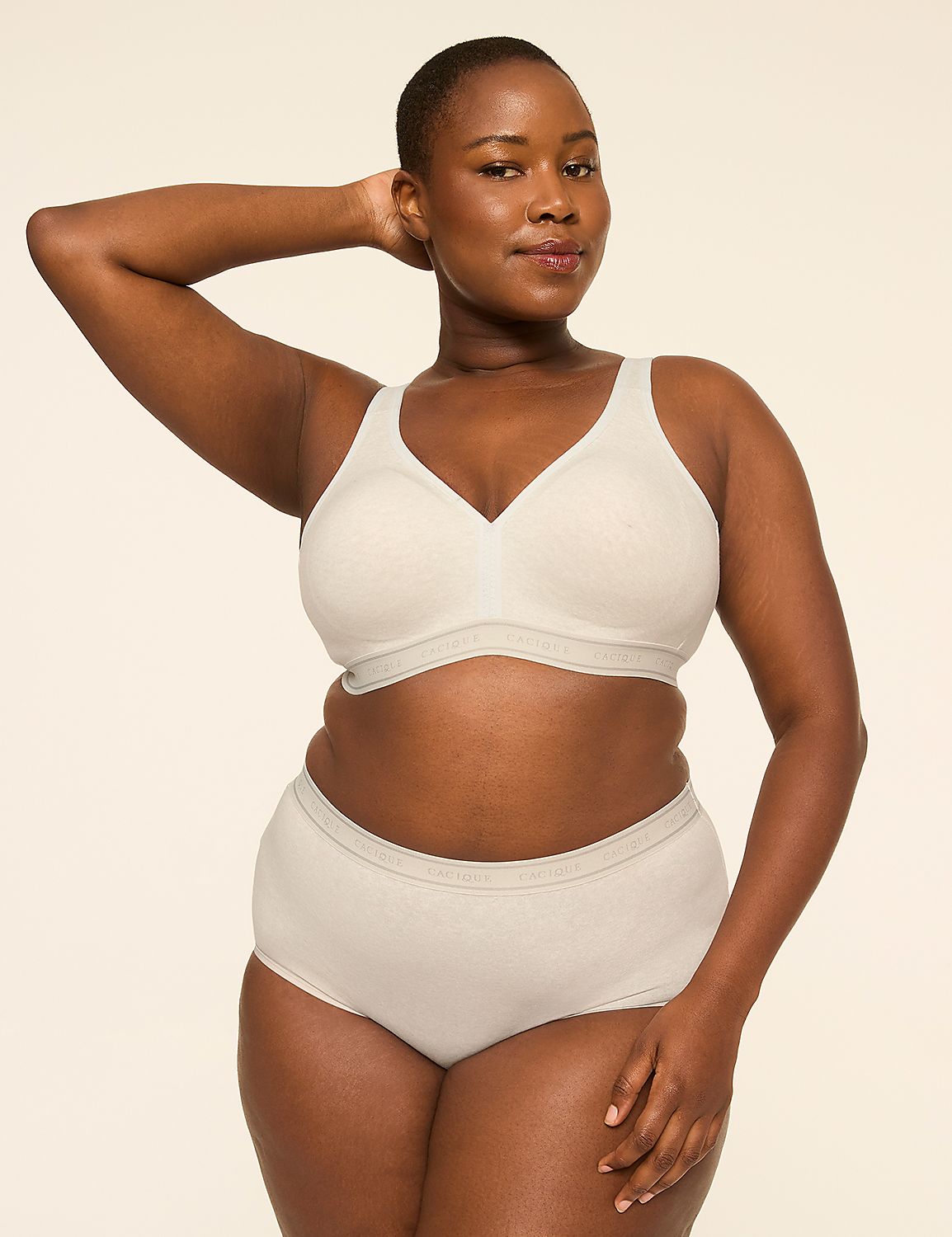 A woman in a beige bra and underwear poses with her arm behind her head against a plain, light background. Product Image 4