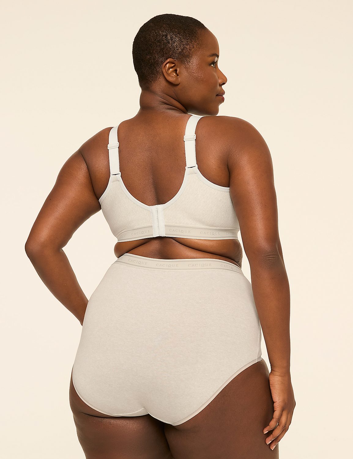 A woman in a beige bra and high-waisted briefs stands against a plain, light-colored background. Product Image 2