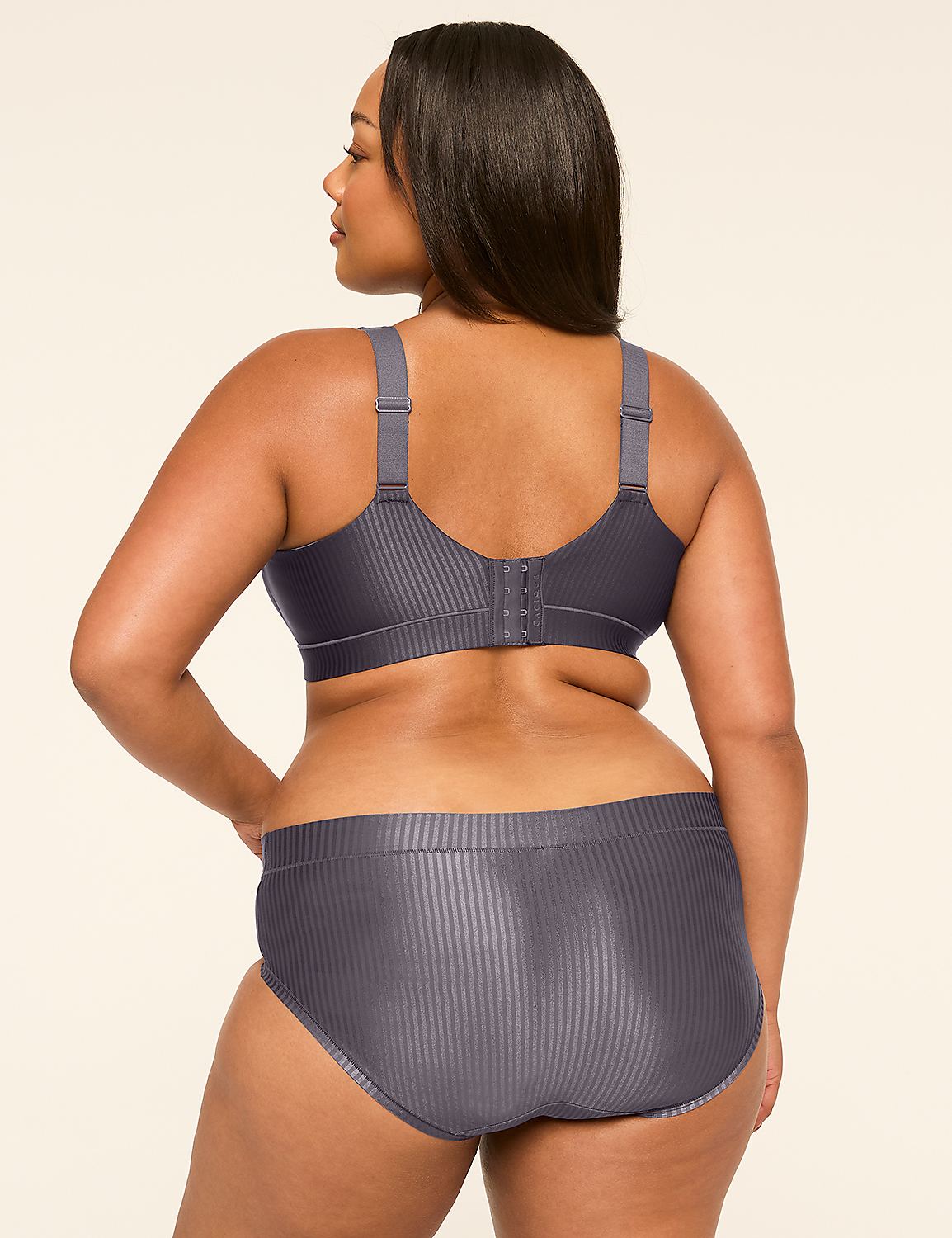 A woman in a grey ribbed bra and underwear stands with her back to the camera against a plain, light-colored background. Product Image 2