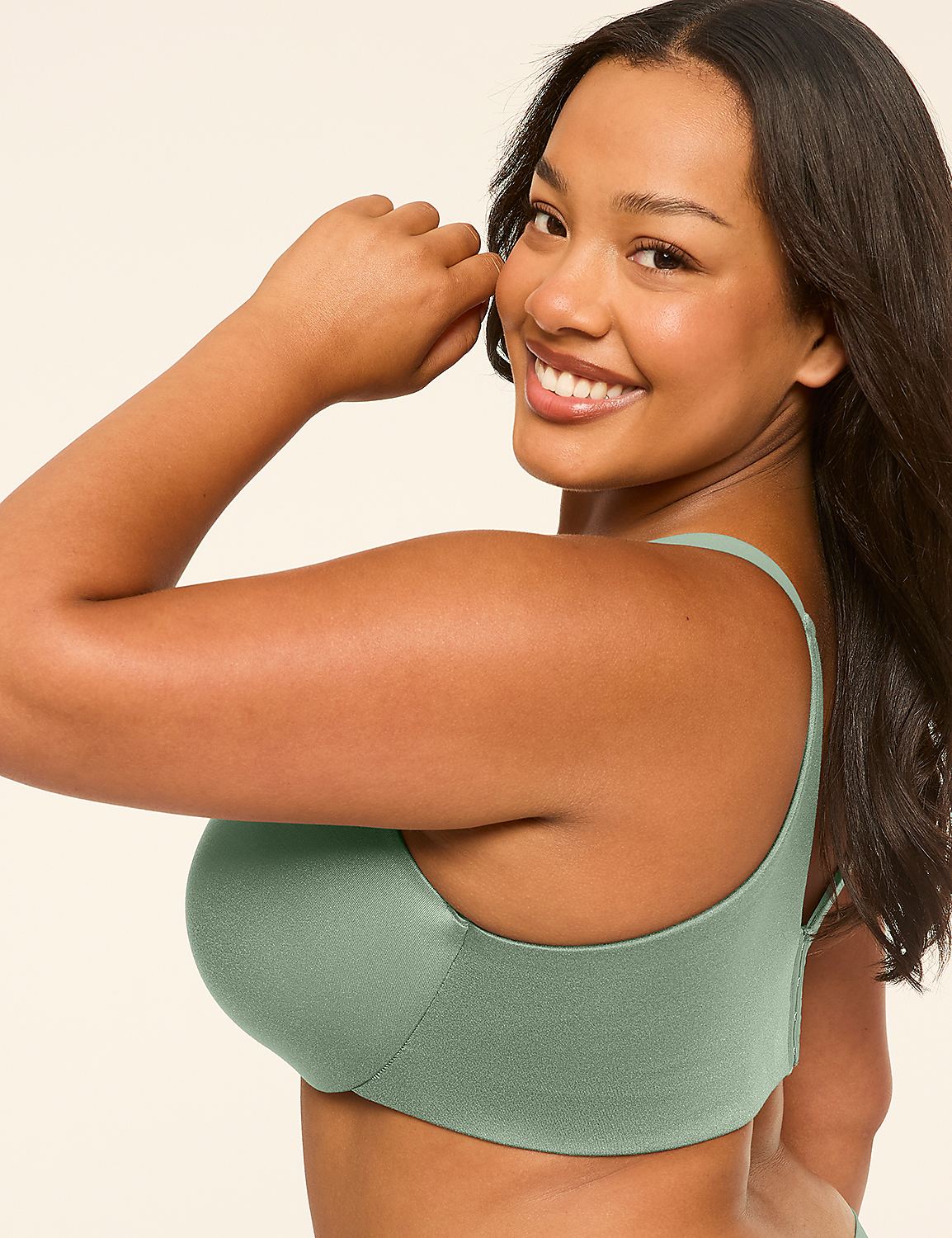 A smiling woman in a green bra is shown from the side against a plain, light-colored background. Product Image 3