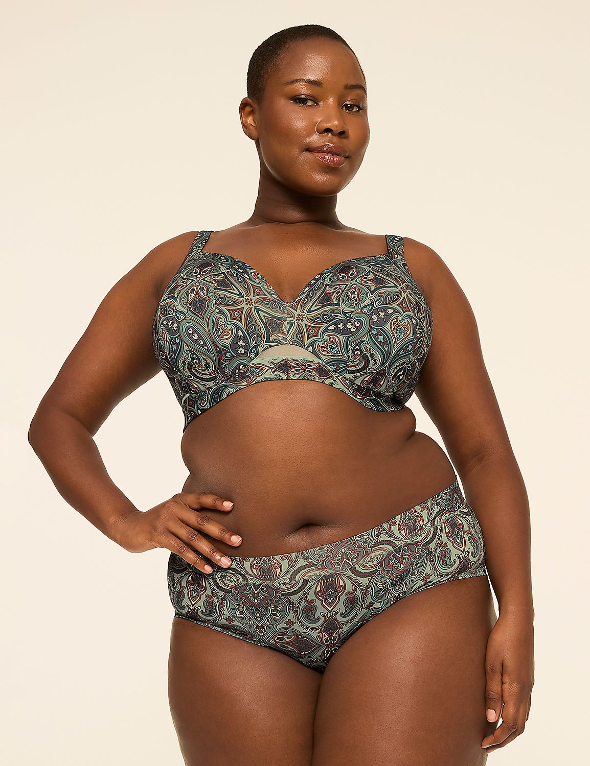 A woman in a patterned bra and underwear stands against a plain, light-colored background. Product Image 4