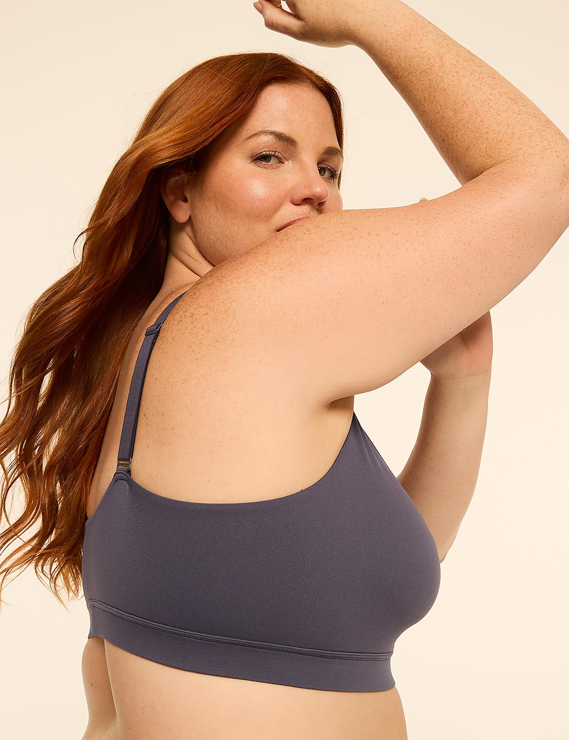 A woman with auburn hair poses in a grey bra against a plain, light-colored background. Product Image 3