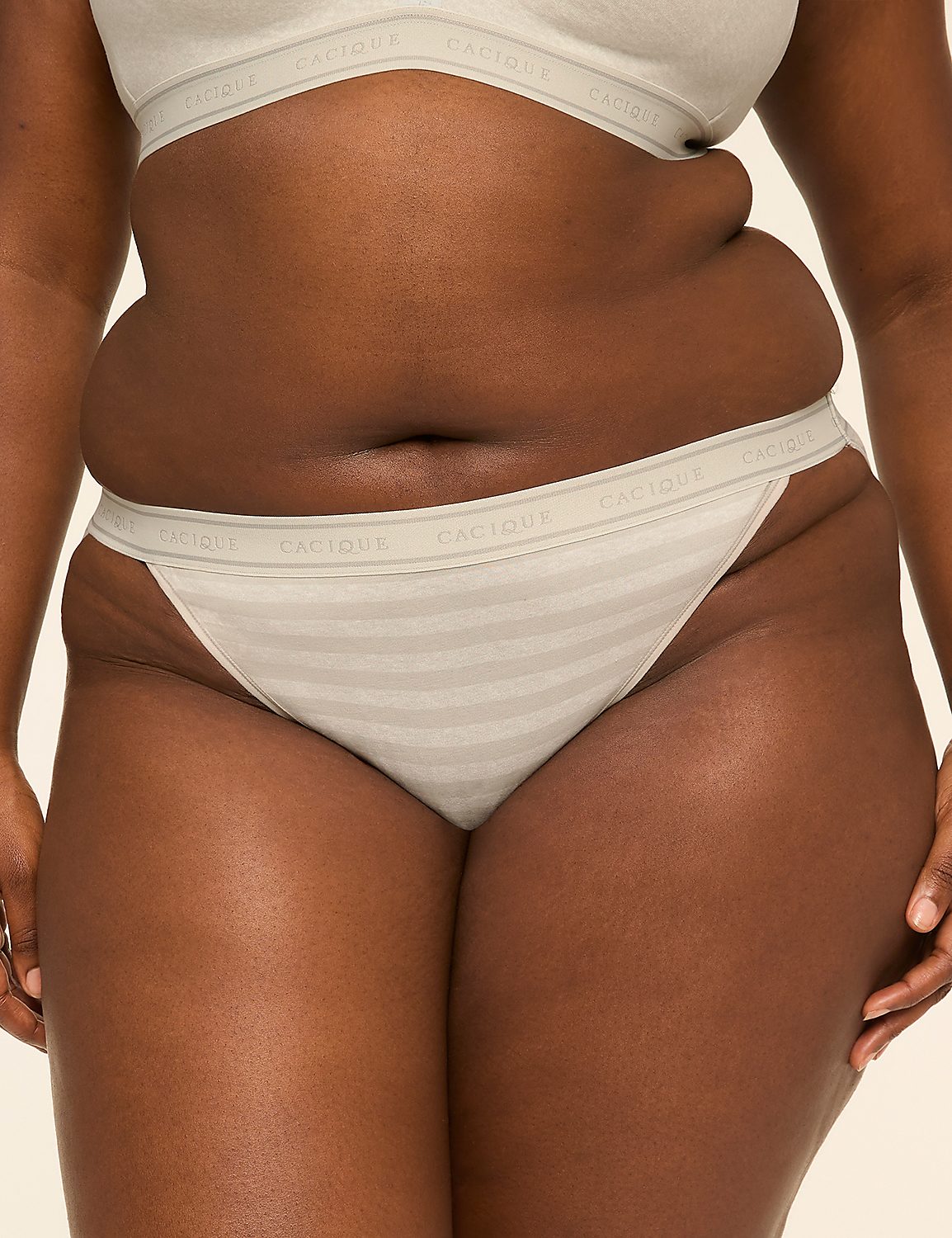 A person's torso, from the waist down, is shown wearing light-colored striped underwear against a plain background. Product Image 1