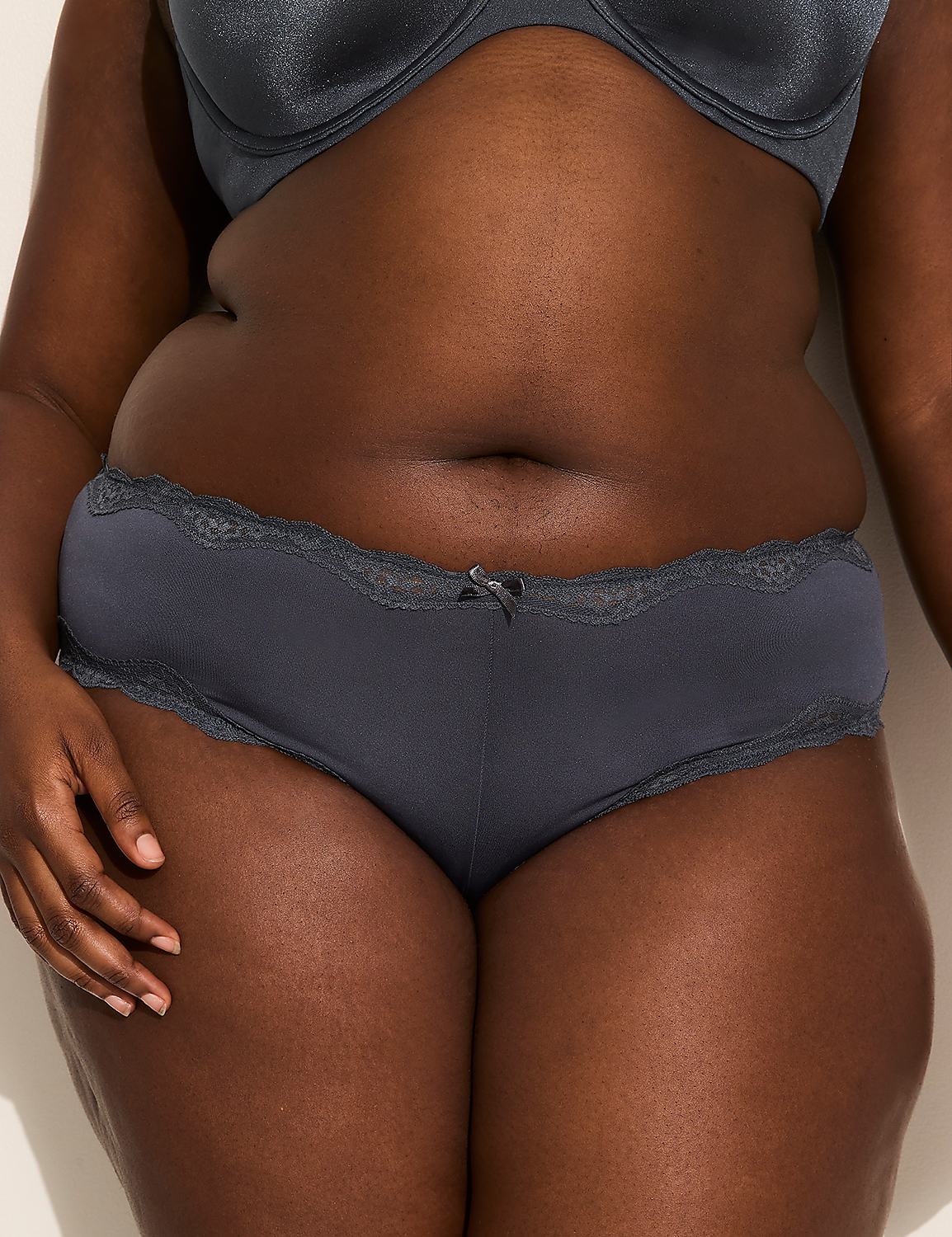 A person's torso is shown from the waist down, wearing dark grey underwear with lace trim, against a plain, light-colored background. Product Image 2