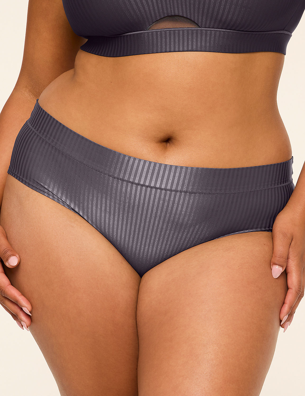 A person in dark grey ribbed underwear and a matching bra is shown against a plain, light background. Product Image 1