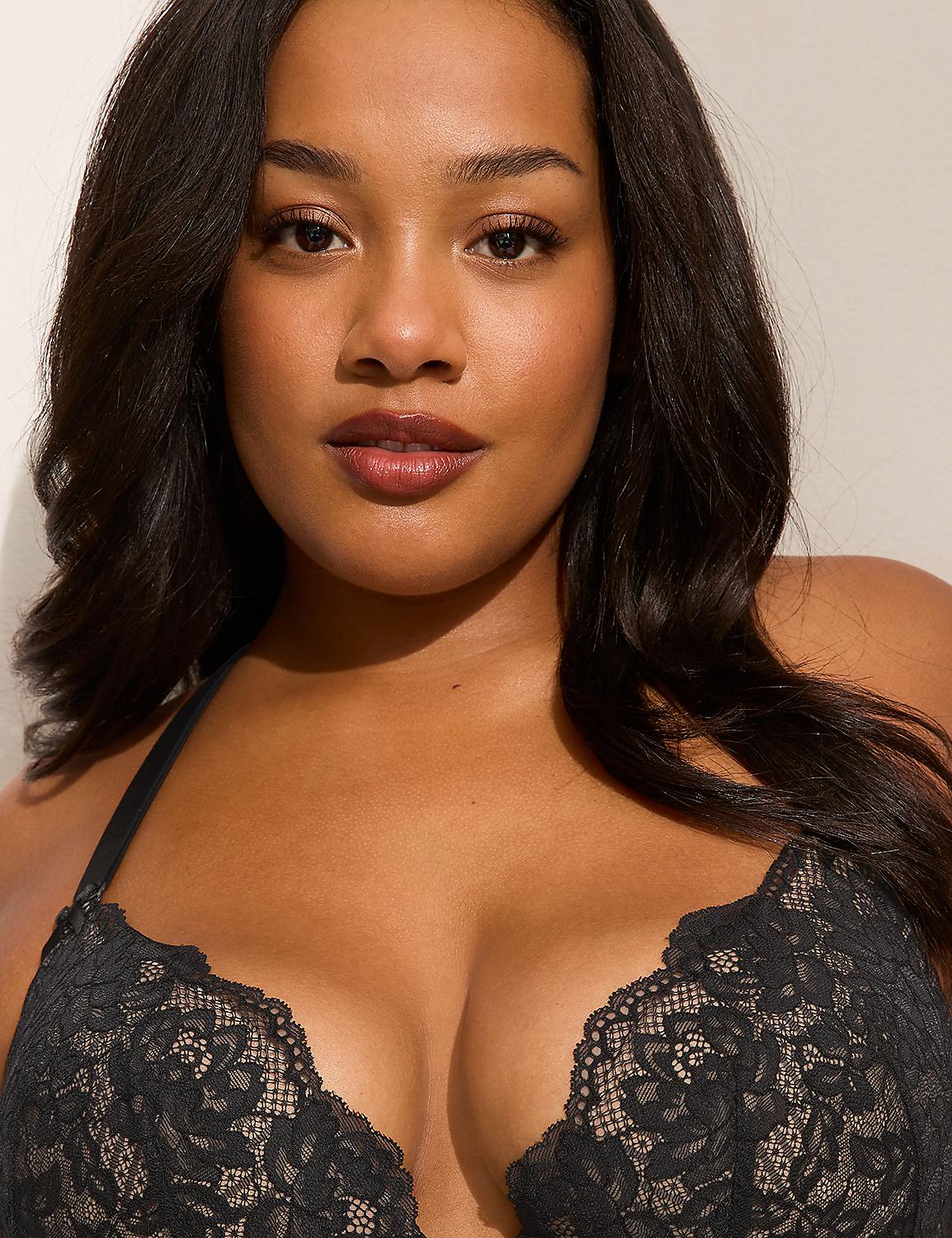 A woman with dark hair and full lips wears a black lace bra in the foreground, with a plain, light-colored background. Product Image 2
