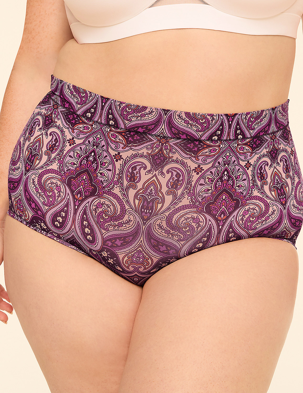 A person wears high-waisted purple paisley patterned underwear against a plain background. Product Image 1