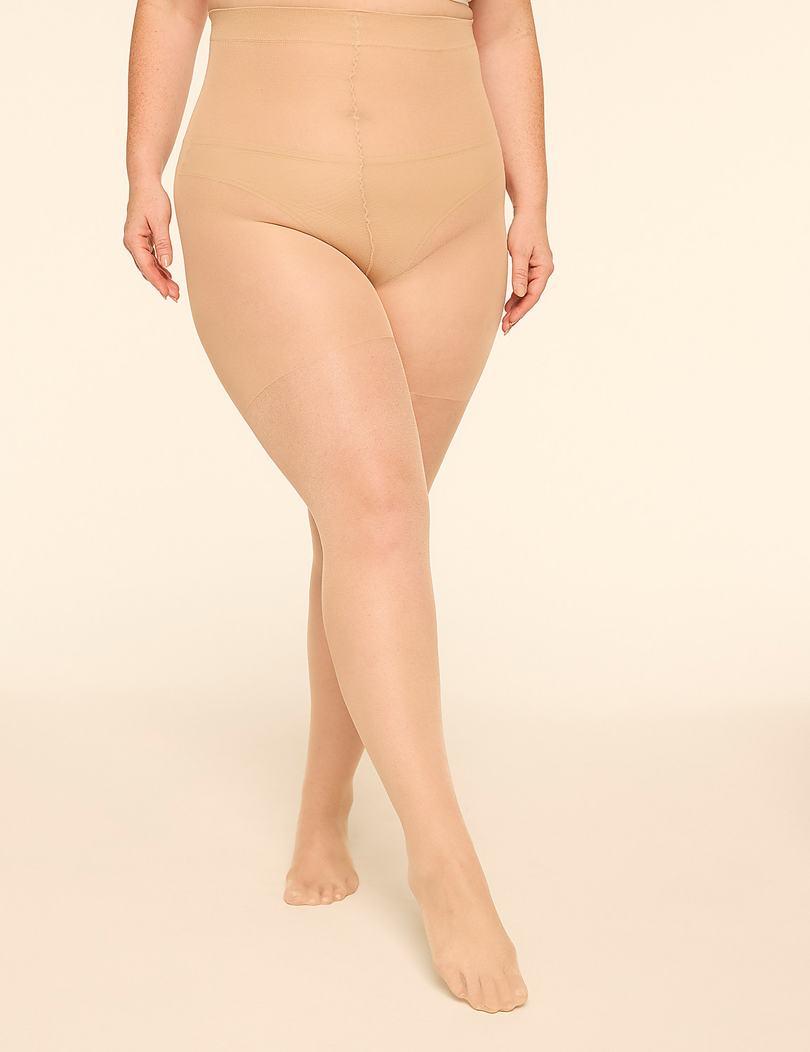 A person's legs and torso, clad in sheer nude pantyhose, stand against a plain, light-colored background. Product Image 1