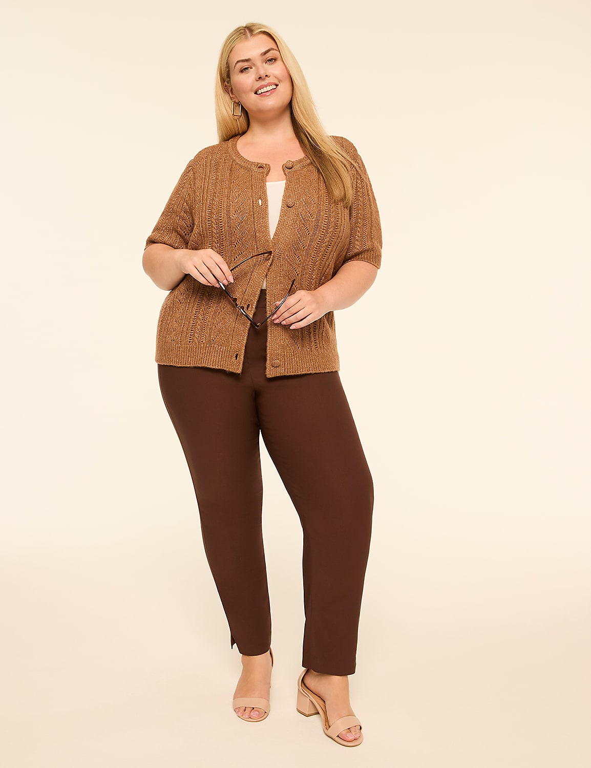 A smiling woman in a brown cardigan and pants stands against a plain, light background. Product Image 3