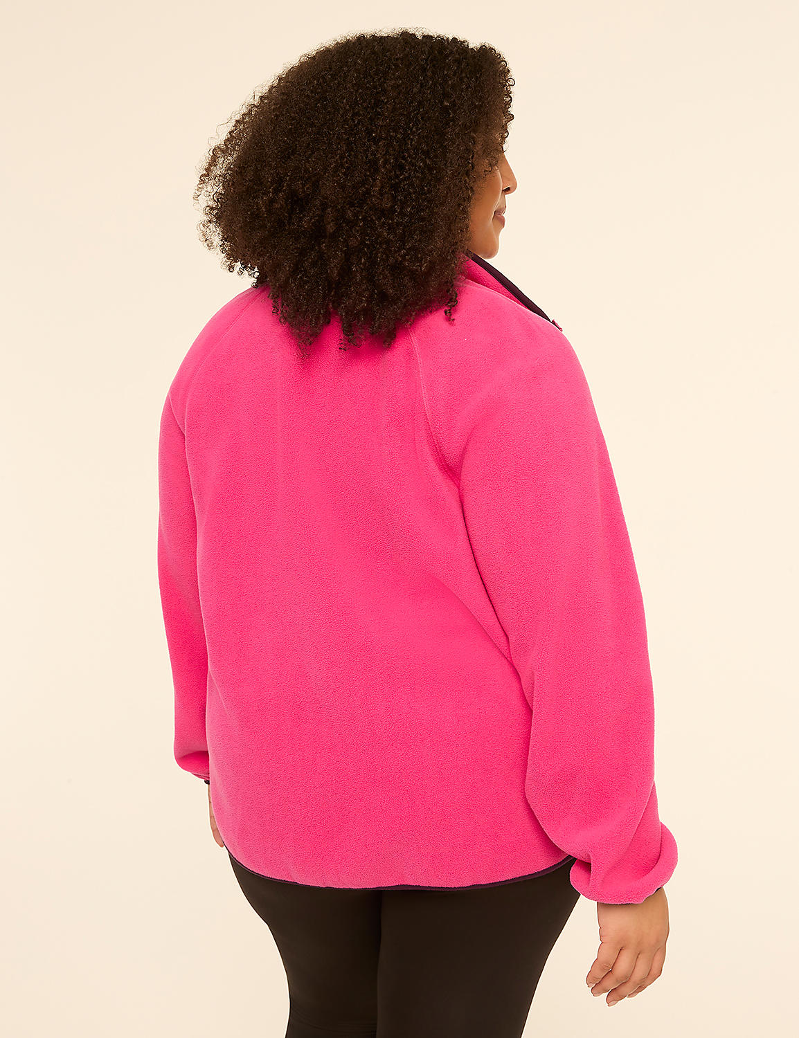 A woman in a bright pink fleece jacket and black leggings stands against a plain, light-colored background. Product Image 2