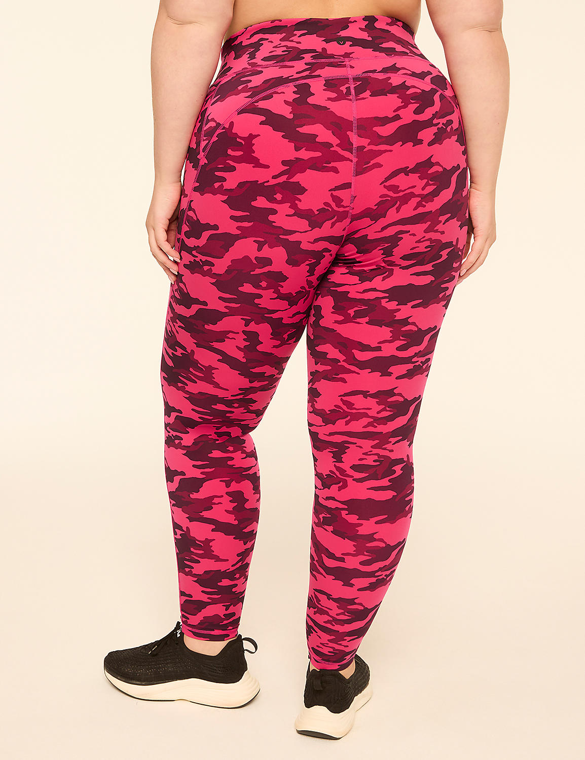A person wearing pink camouflage leggings and black sneakers stands against a plain, light-colored background. Product Image 2