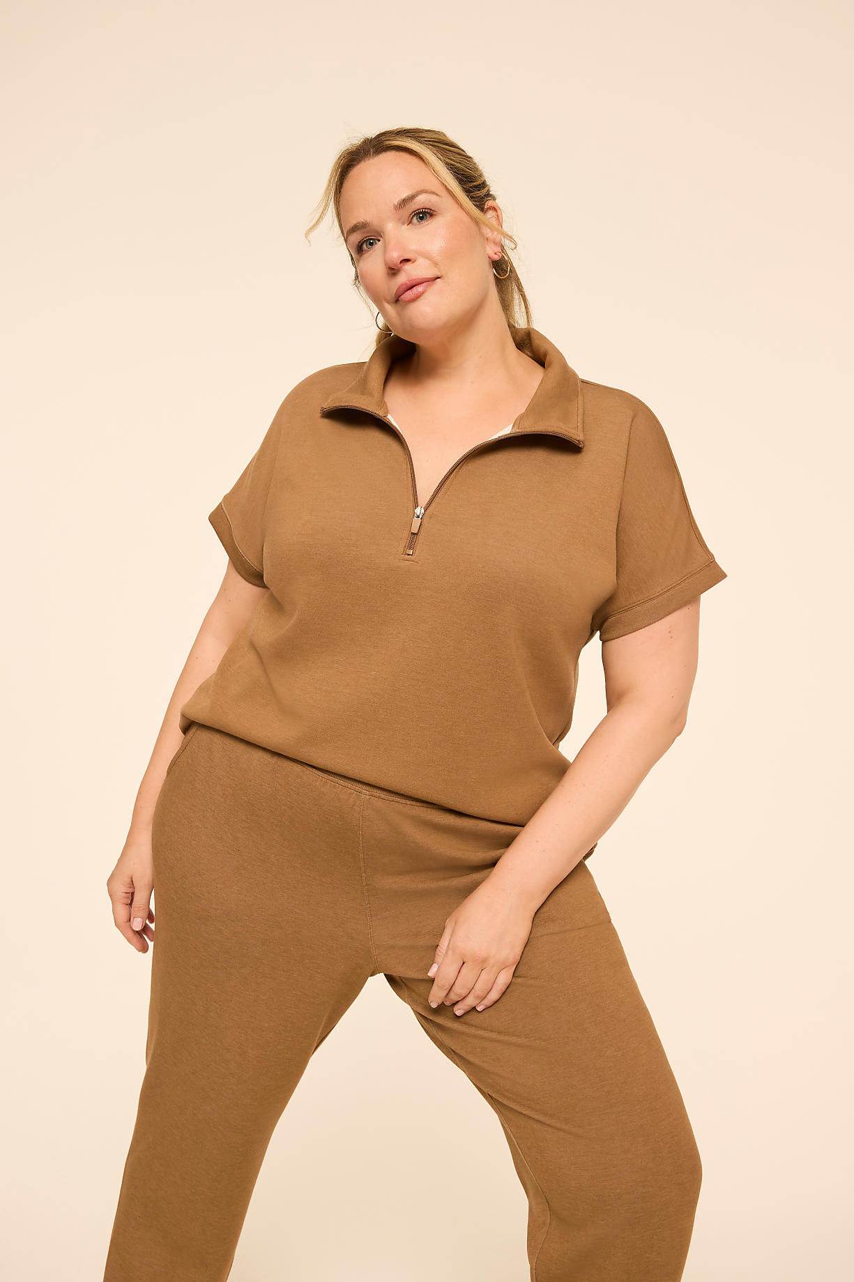A woman in a brown loungewear set poses against a plain, light brown background. Product Image 5
