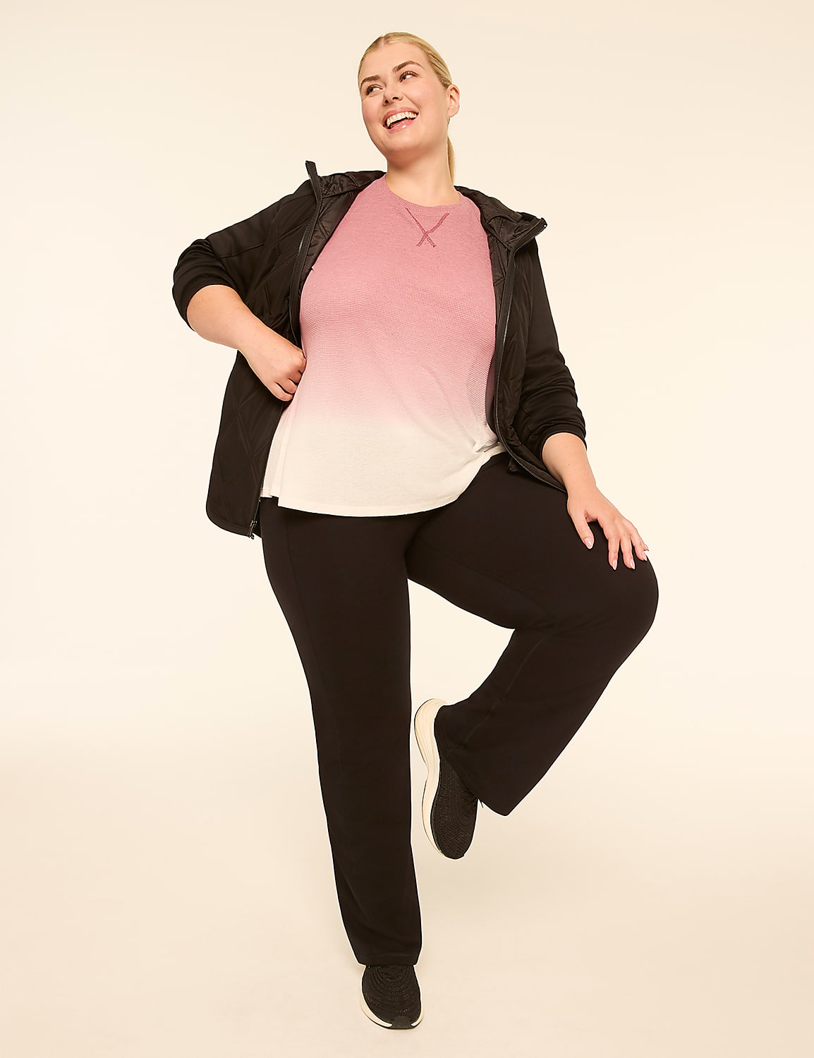 A woman in athletic wear poses against a plain, light-colored background. Product Image 3