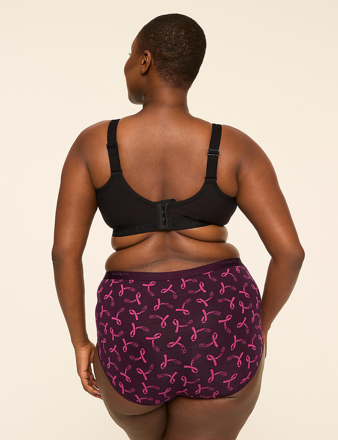 A woman from behind, wearing a black bra and purple patterned underwear, stands against a plain, light-colored background. Product Image 2