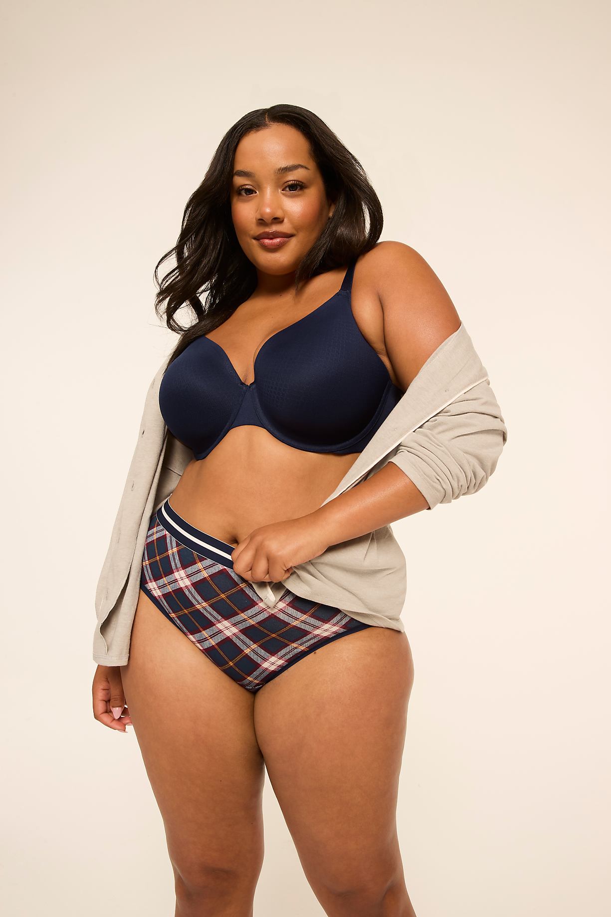 A woman in a navy bra and plaid underwear stands against a plain, light-colored background. Product Image 7