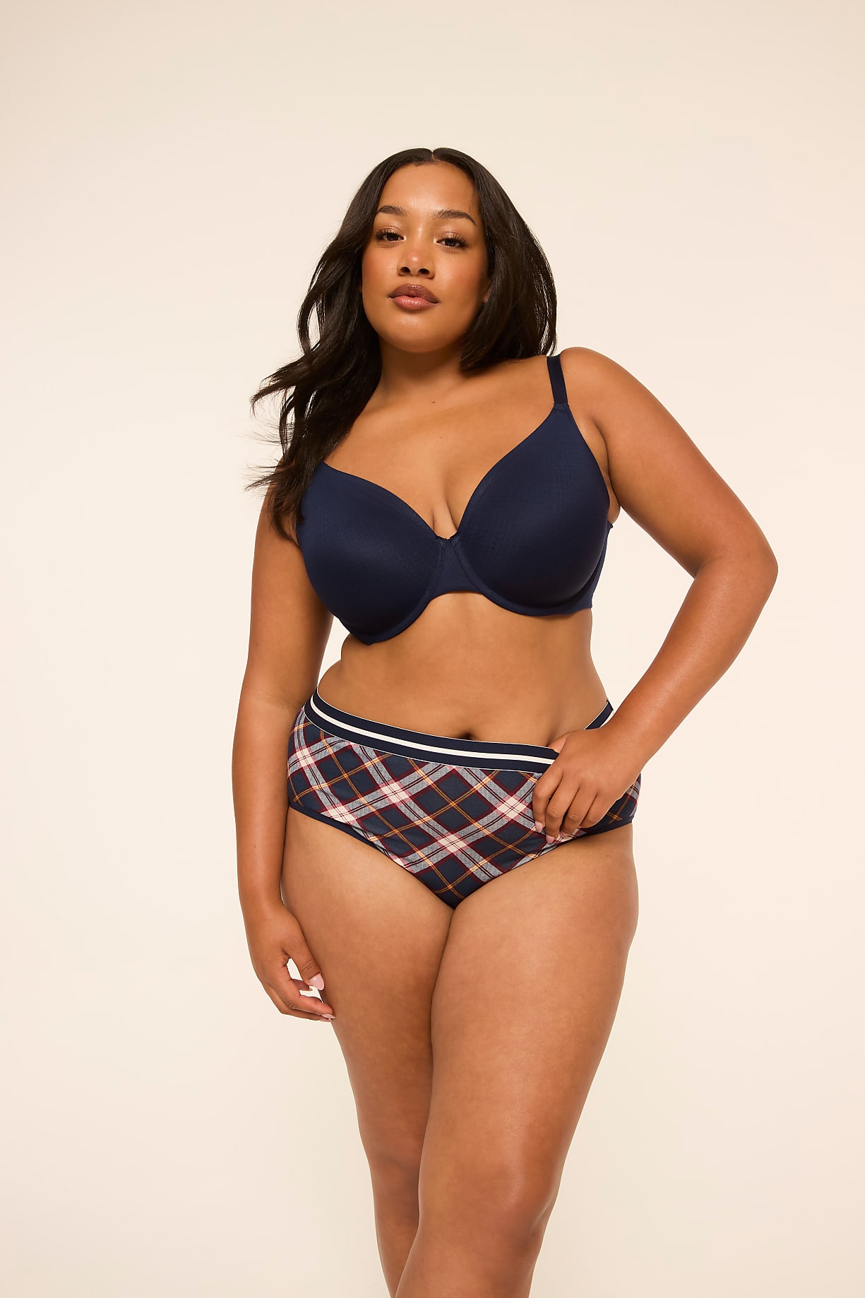 A woman in a navy bra and plaid underwear stands against a plain, light-colored background. Product Image 11