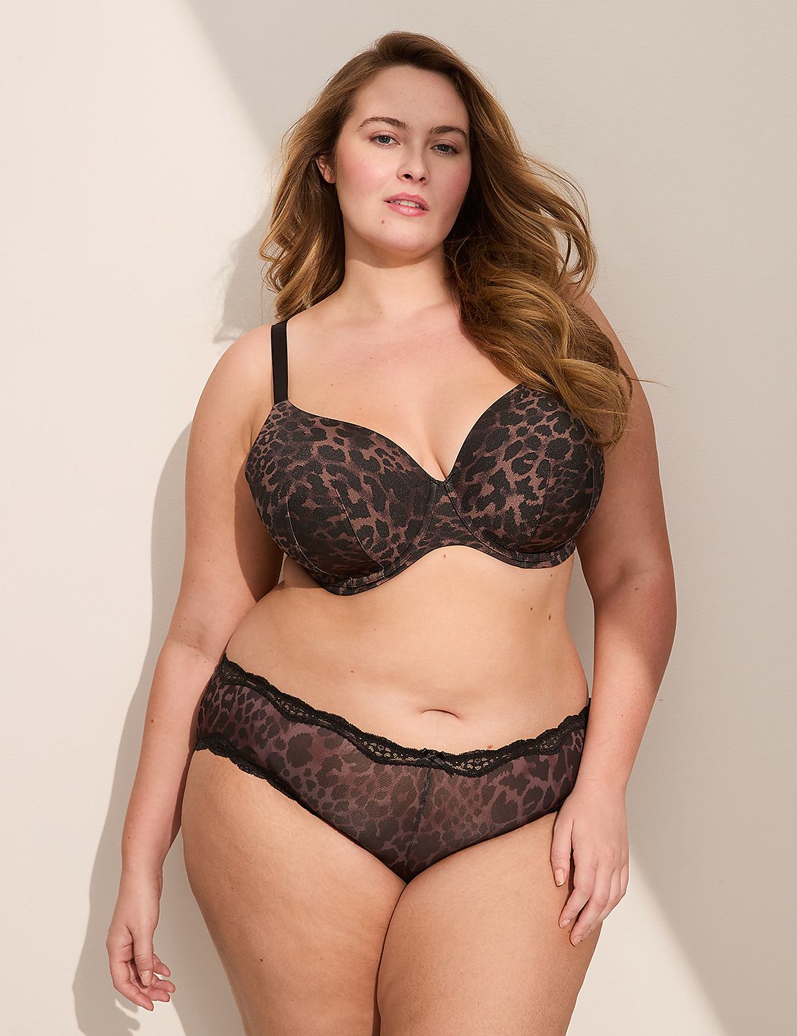 A woman's lower back and buttocks are shown in the foreground, wearing leopard-print lingerie with black lace trim, against a plain white background. Product Image 3