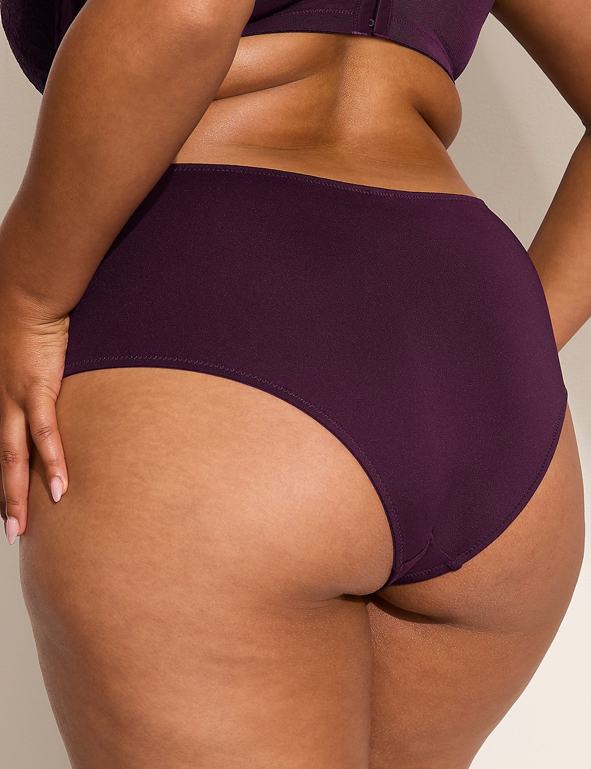 A close-up view of a person's lower back and buttocks in plum-colored underwear is presented against a plain, light-colored background. Product Image 2